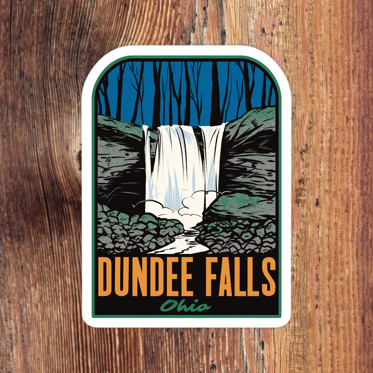 Sticker of Dundee Falls, Ohio with a waterfall illustration on a wooden background