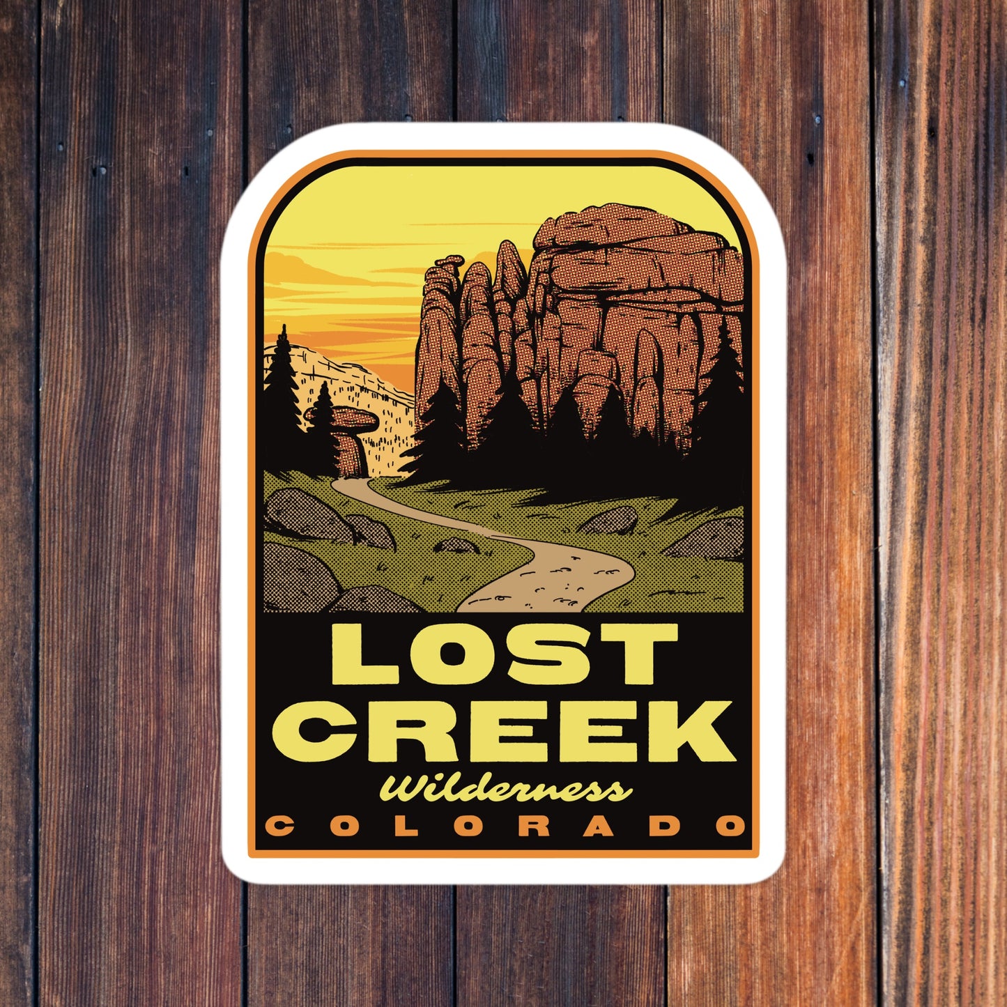 Sticker with 'Lost Creek Wilderness Colorado' design on a wooden background