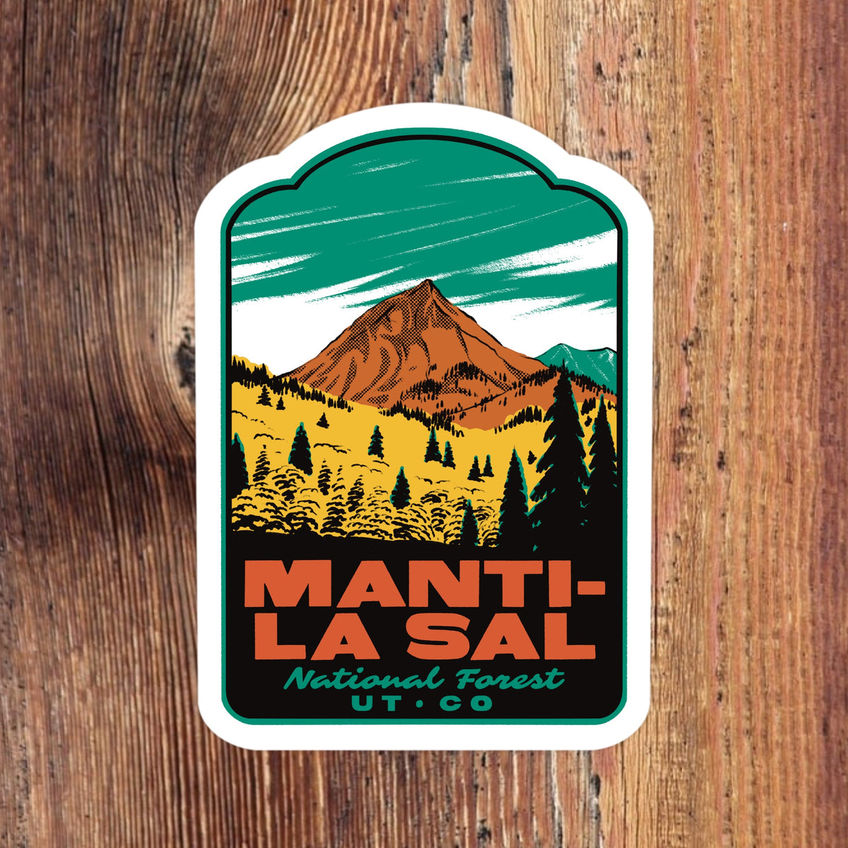 A die-cut sticker featuring a stylized mountain landscape with the text 'MANTI-LA SAL National Forest UT. CO.