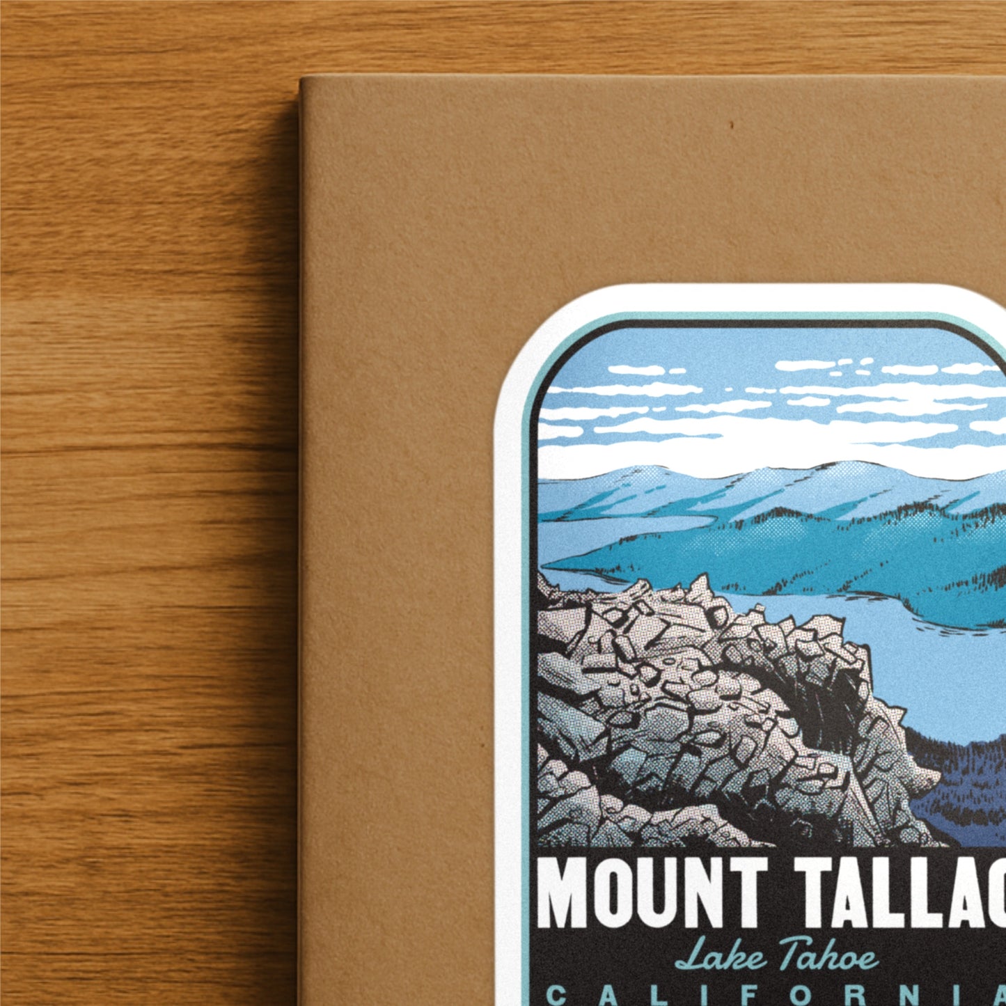 A retro travel decal of Mount Tallac California on a hiking journal