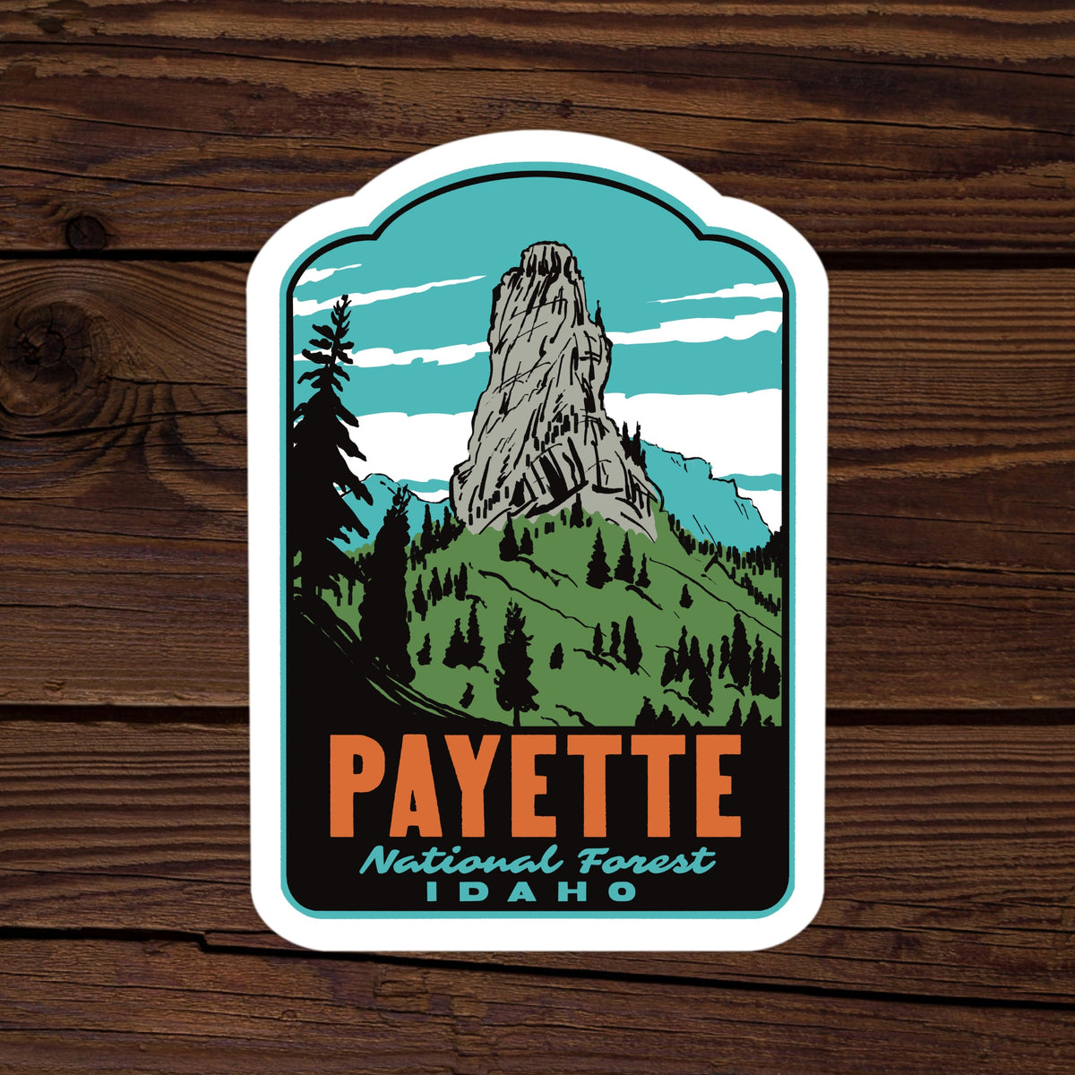 a sticker of Payette National Forest on a wood background