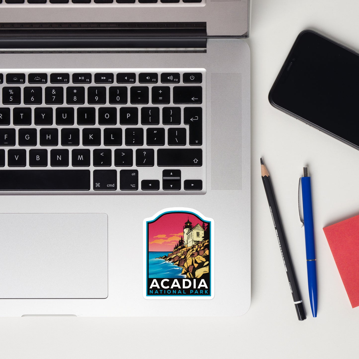 A sticker of Acadia National Park on a laptop