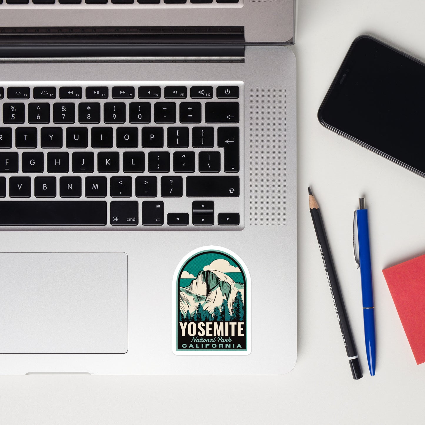 A sticker of Yosemite National Park on a laptop