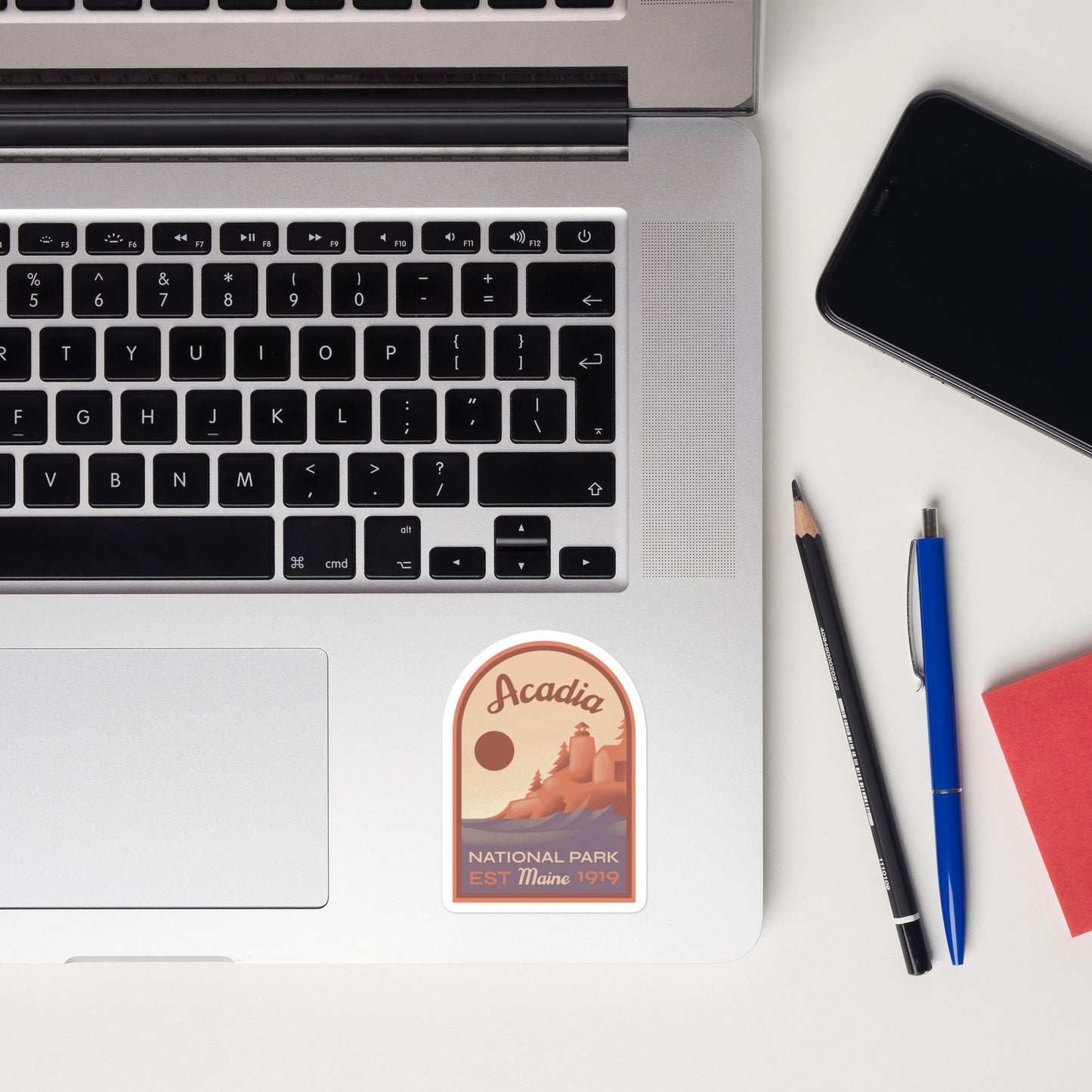 A sticker of Acadia National Park on a laptop