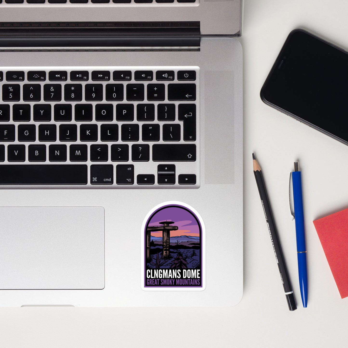 A sticker of Clingmans Dome on a laptop