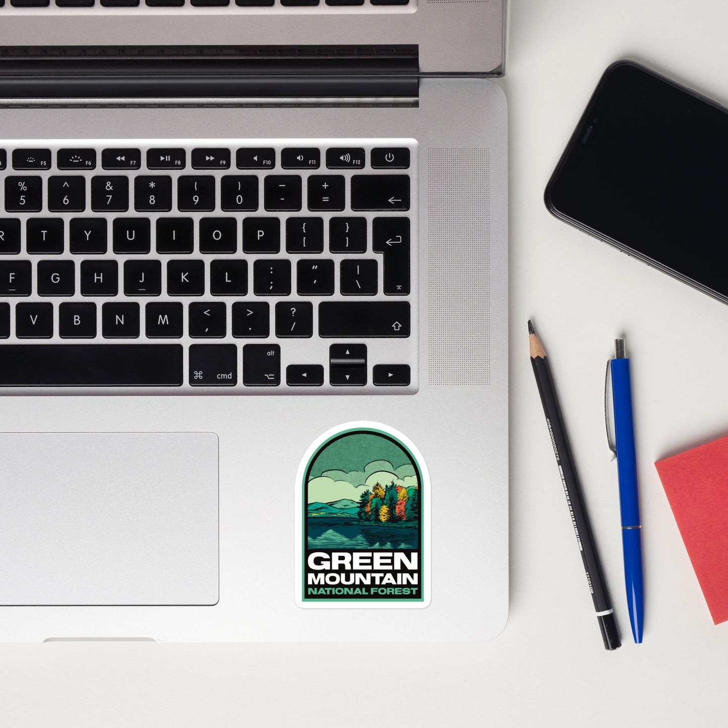 A sticker of Green Mountain National Forest on a laptop