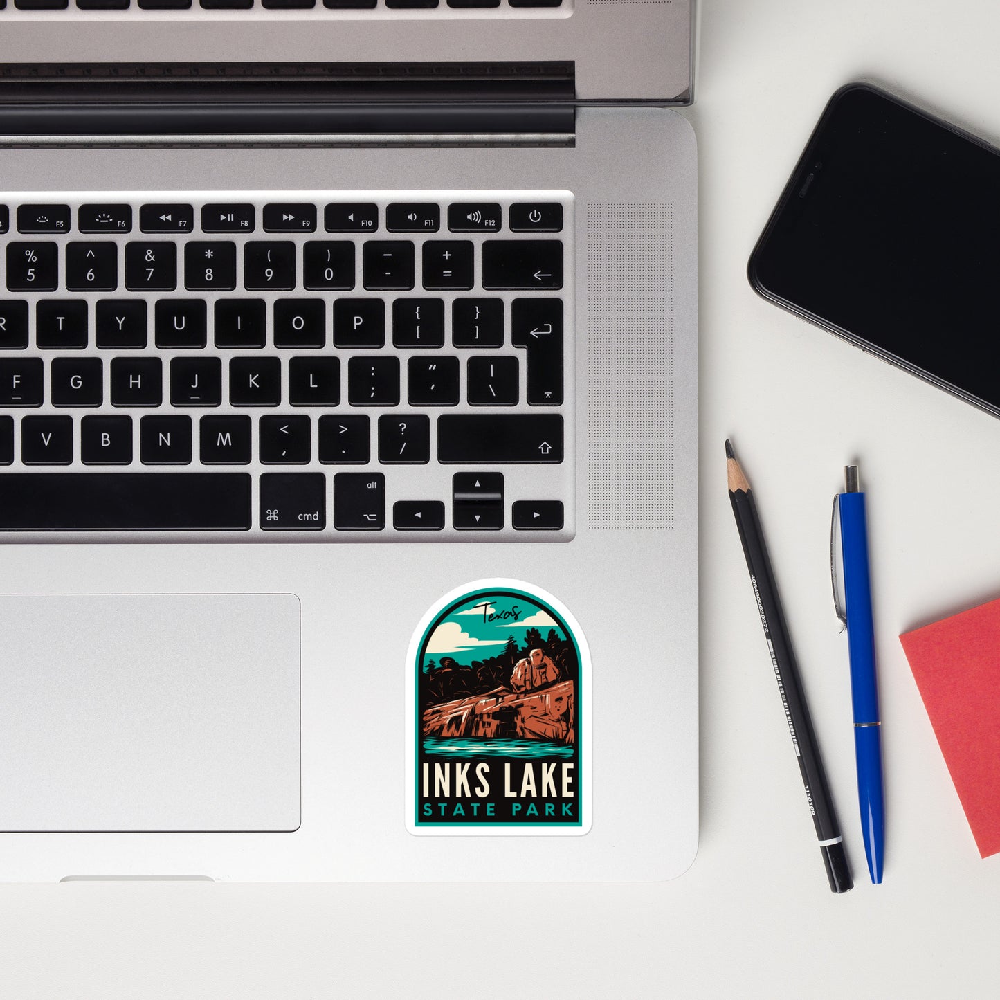 A sticker of Inks Lake State Park on a laptop