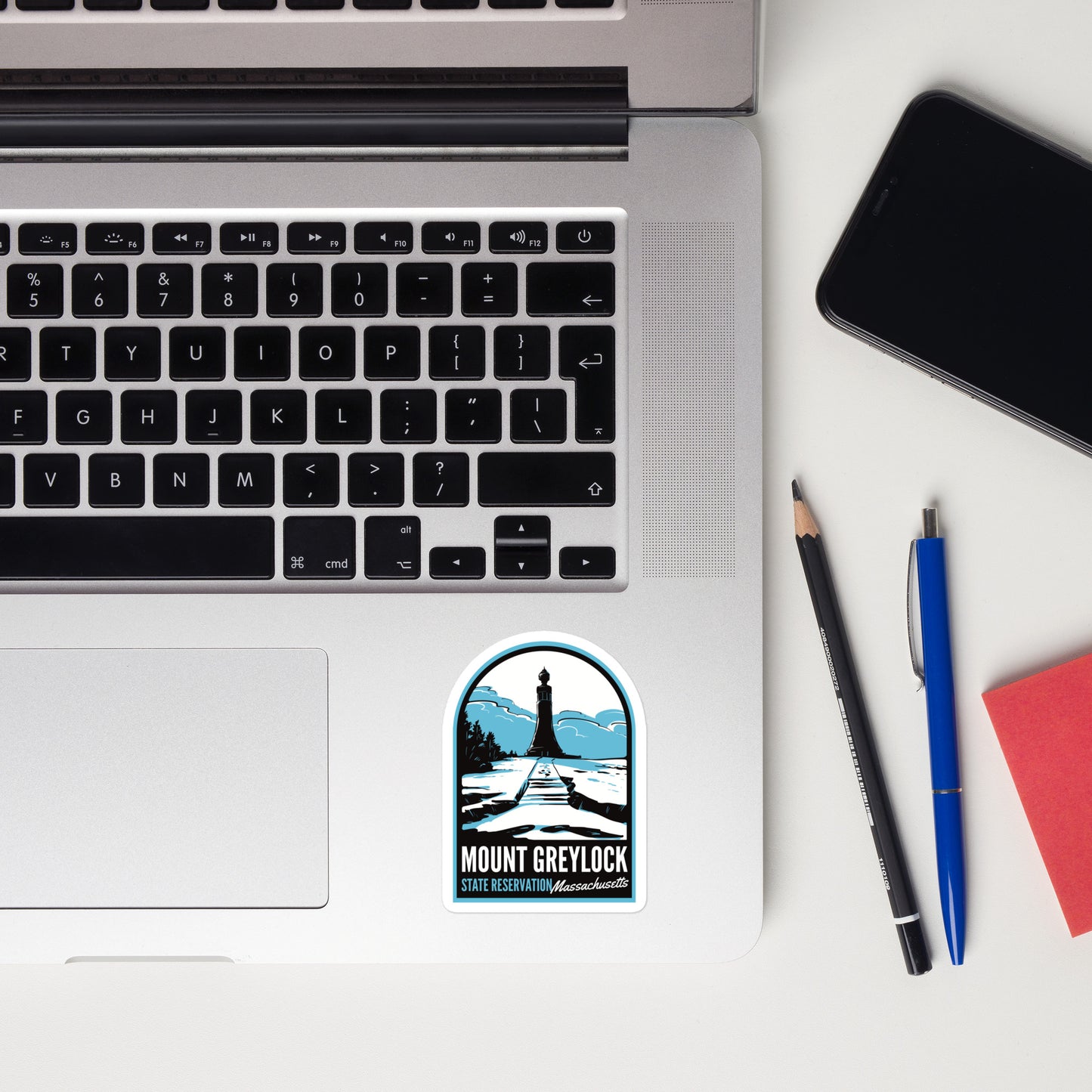 A sticker of Mount Greylock on a laptop