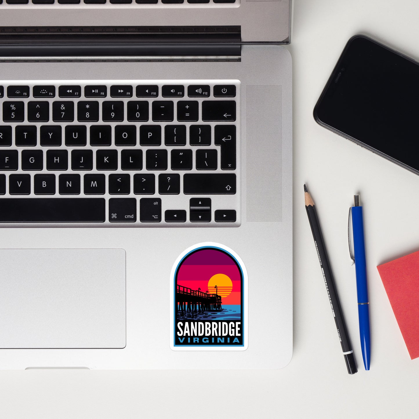 A sticker of Sandbridge Virginia on a laptop