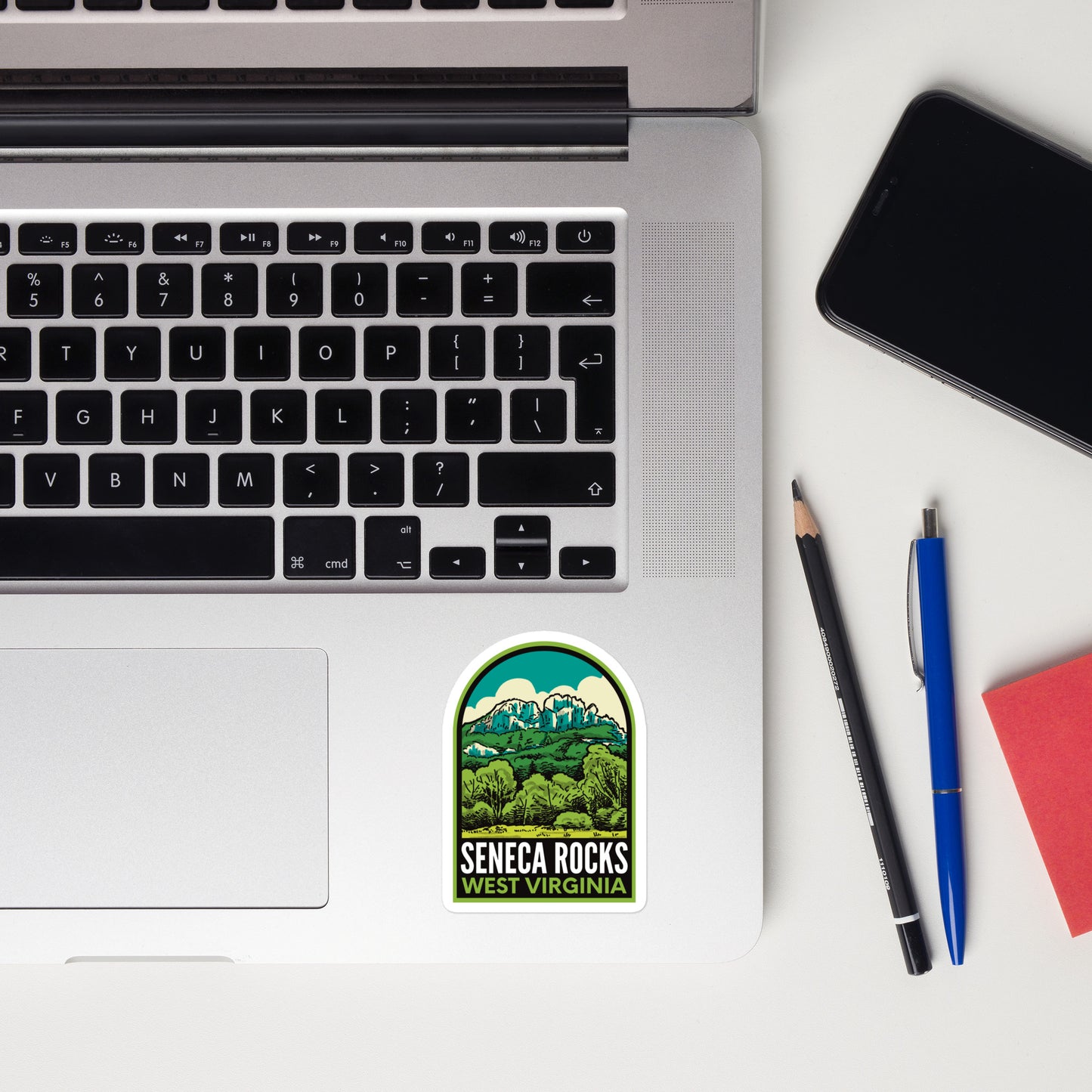 A sticker of Seneca Rocks West Virginia on a laptop