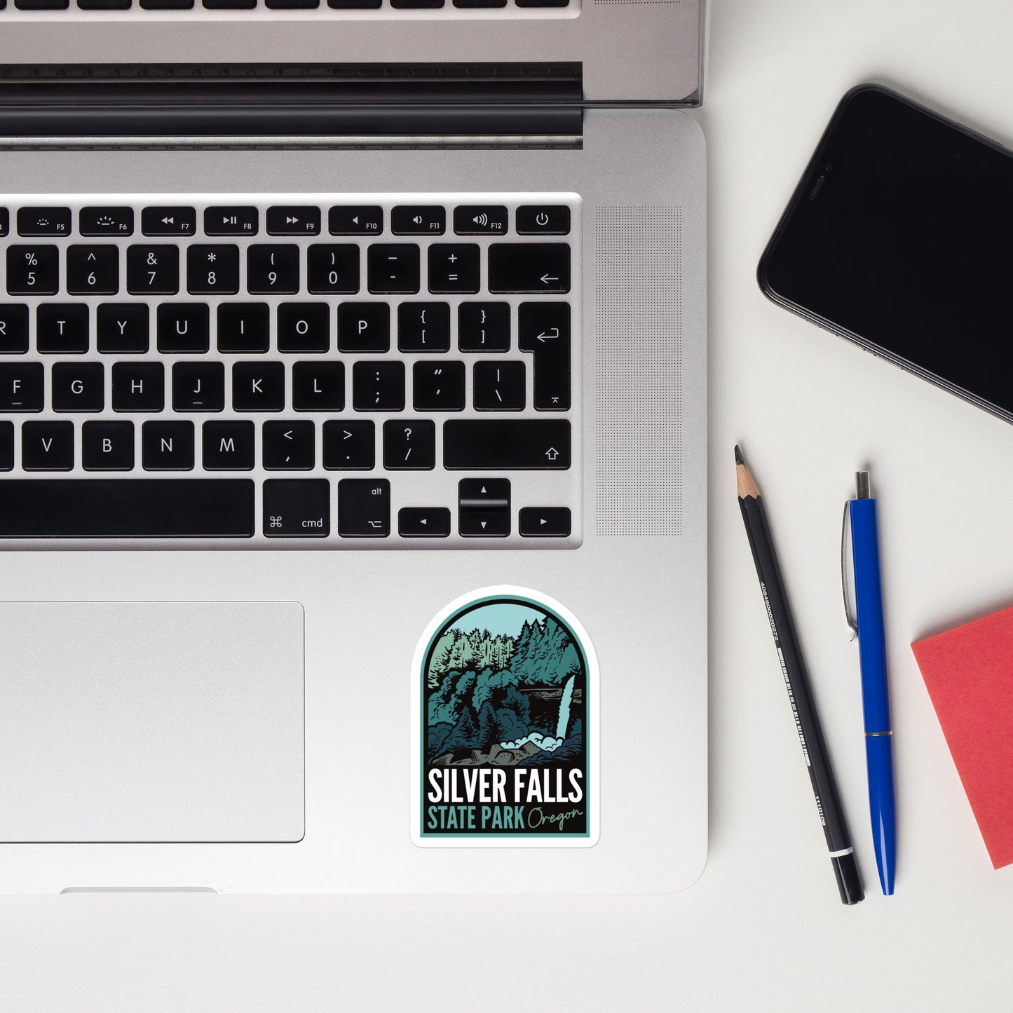 A sticker of Silver Falls State Park on a laptop