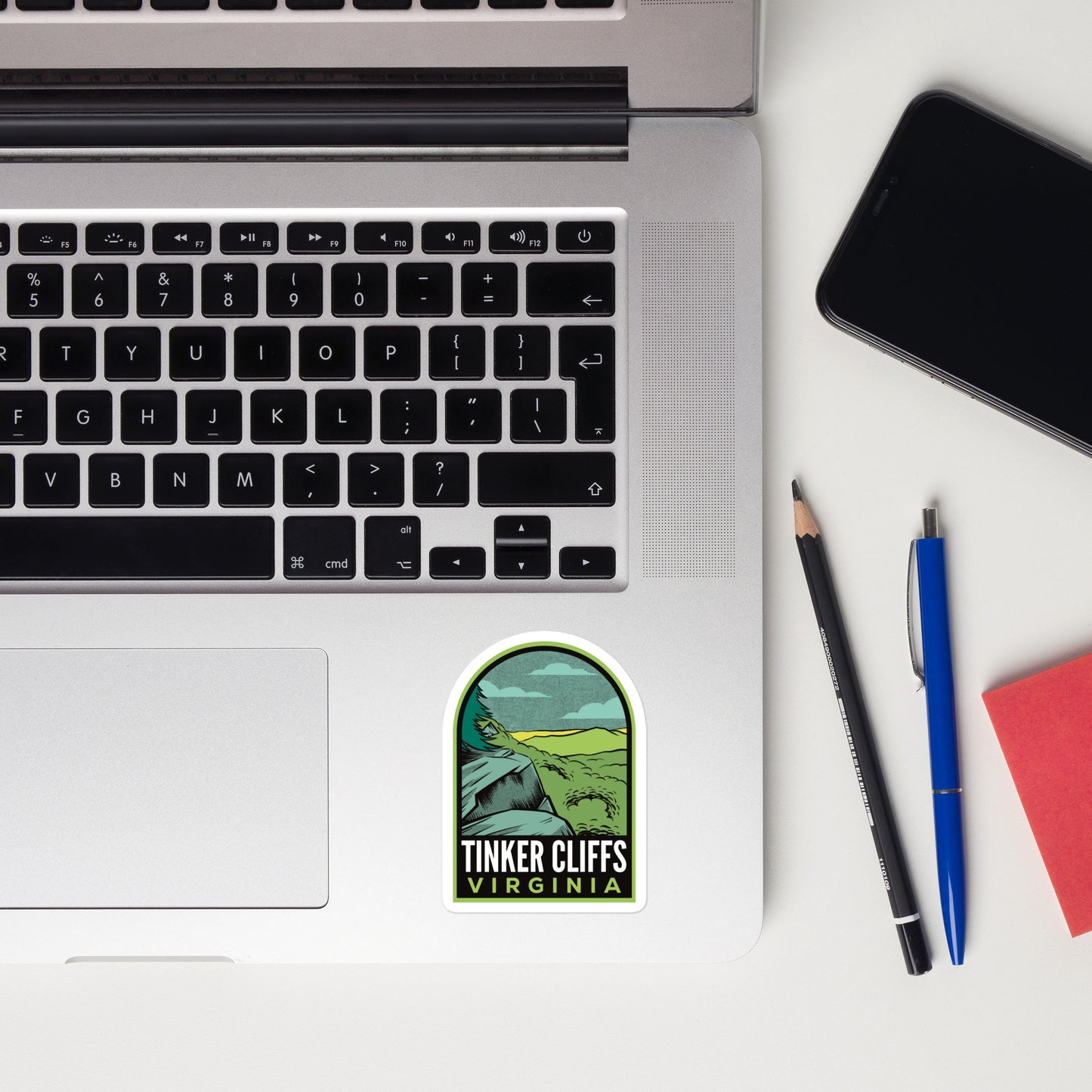 A sticker of Tinker Cliffs Virginia on a laptop