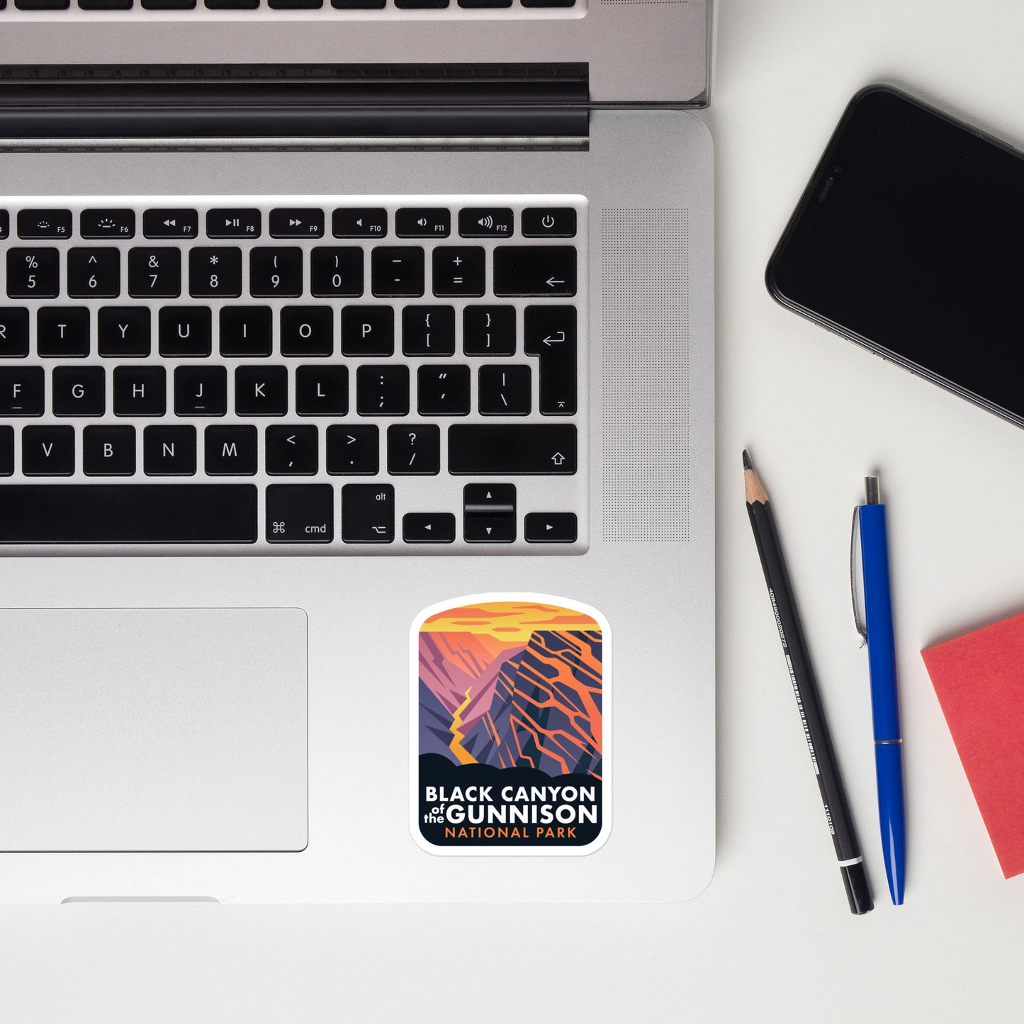 A sticker of Black Canyon of the Gunnison on a laptop