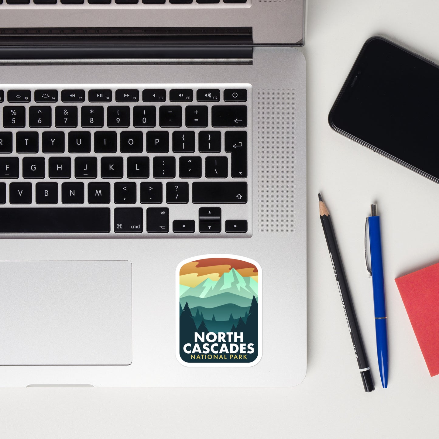 A sticker of North Cascades National Park on a laptop