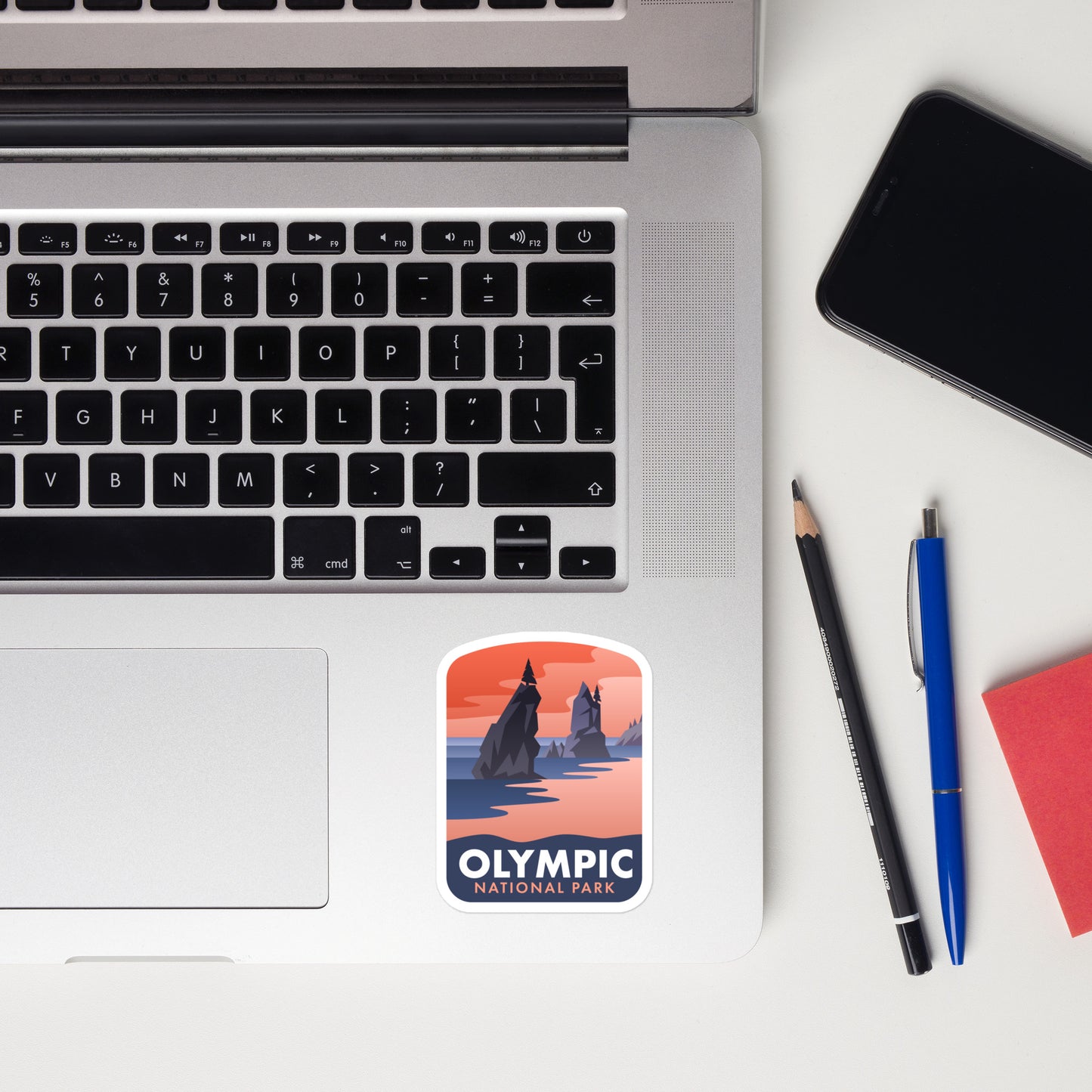 A sticker of Olympic National Park on a laptop