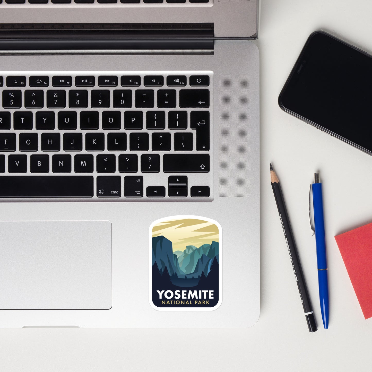 A sticker of Yosemite National Park on a laptop