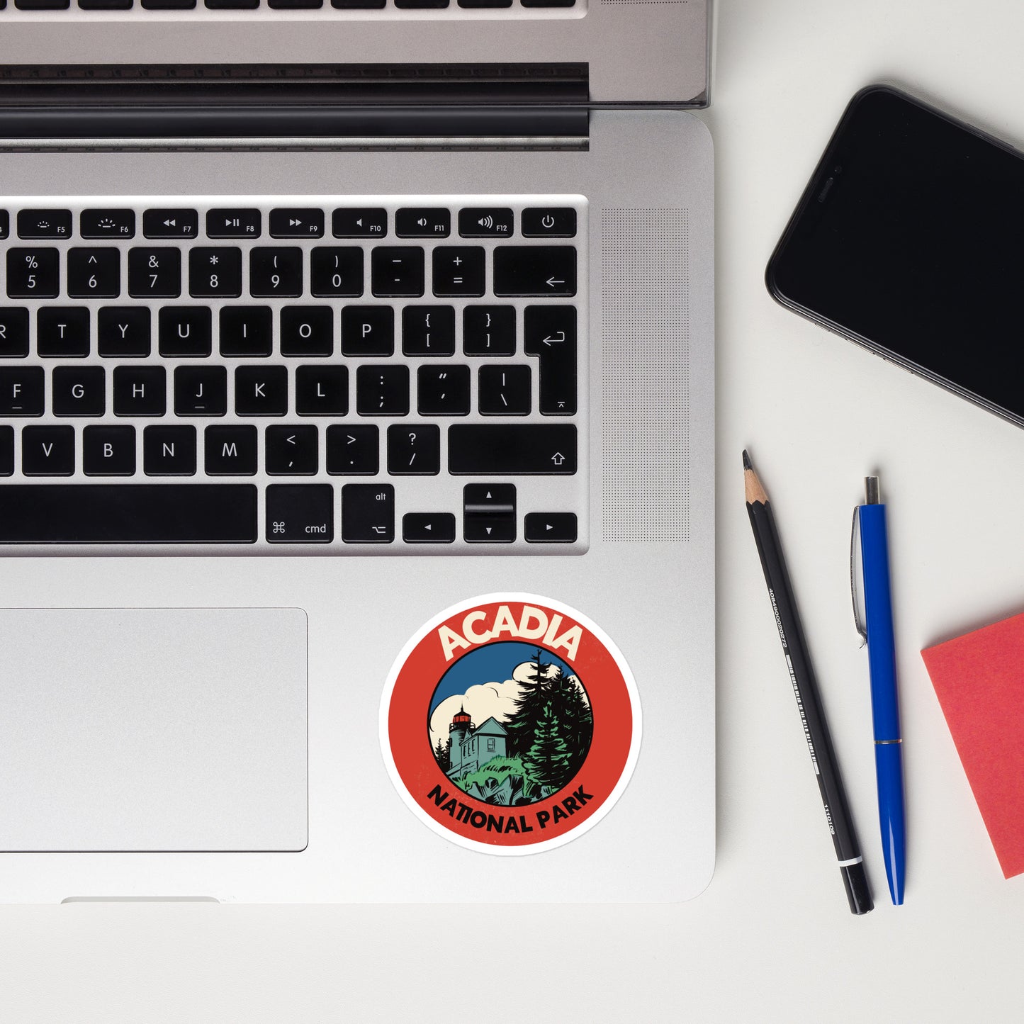 A sticker of Acadia National Park on a laptop