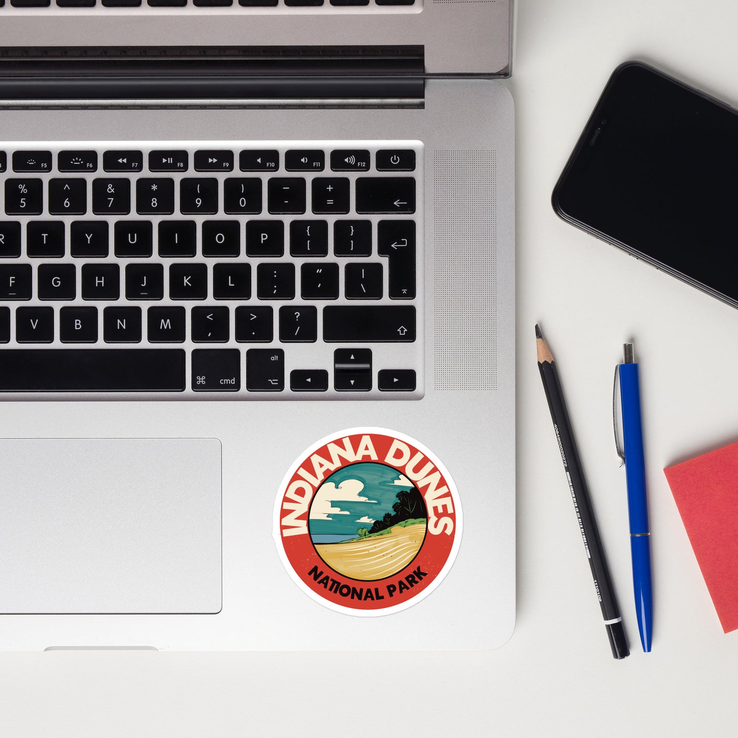 A sticker of Indiana Dunes National Park on a laptop