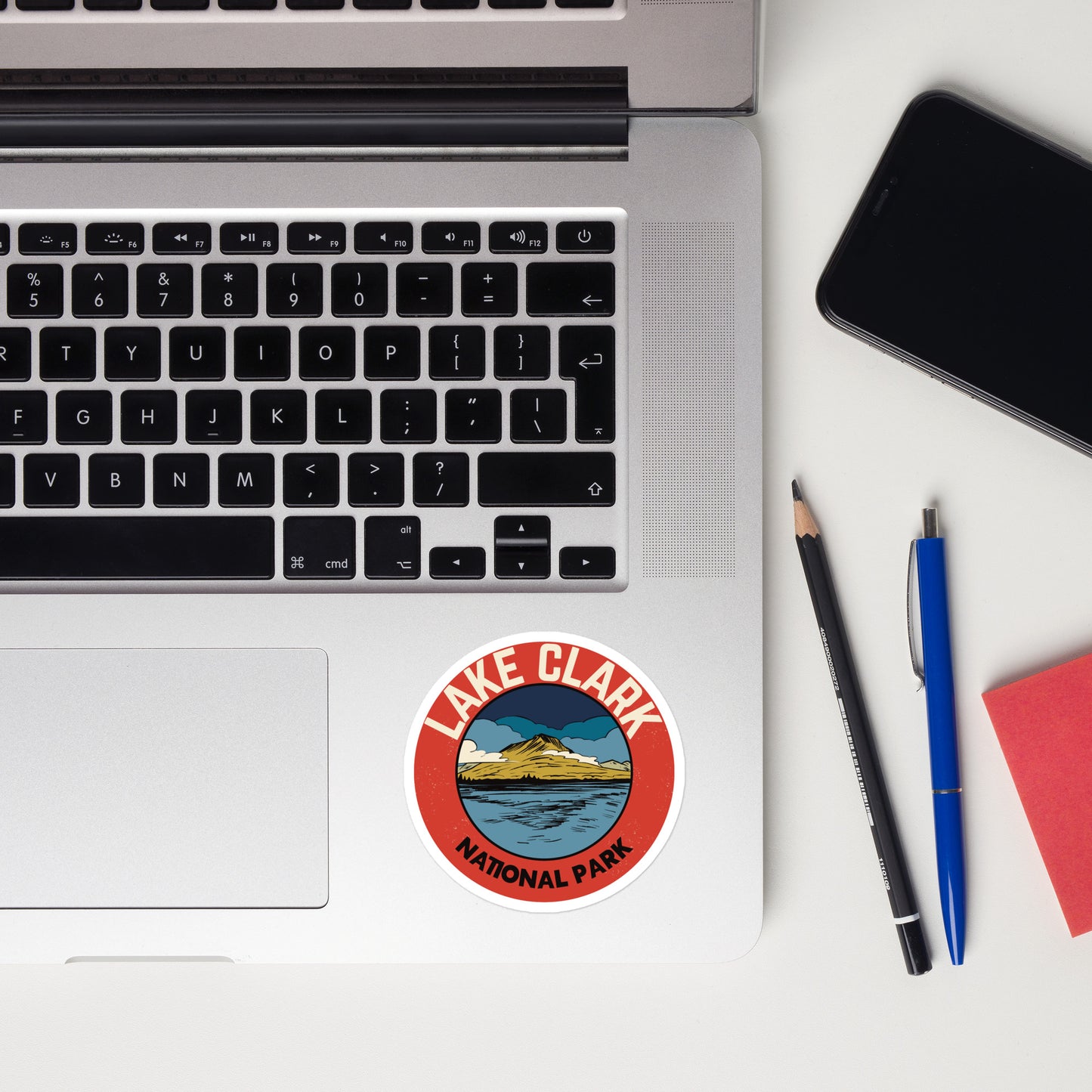A sticker of Lake Clark National Park on a laptop