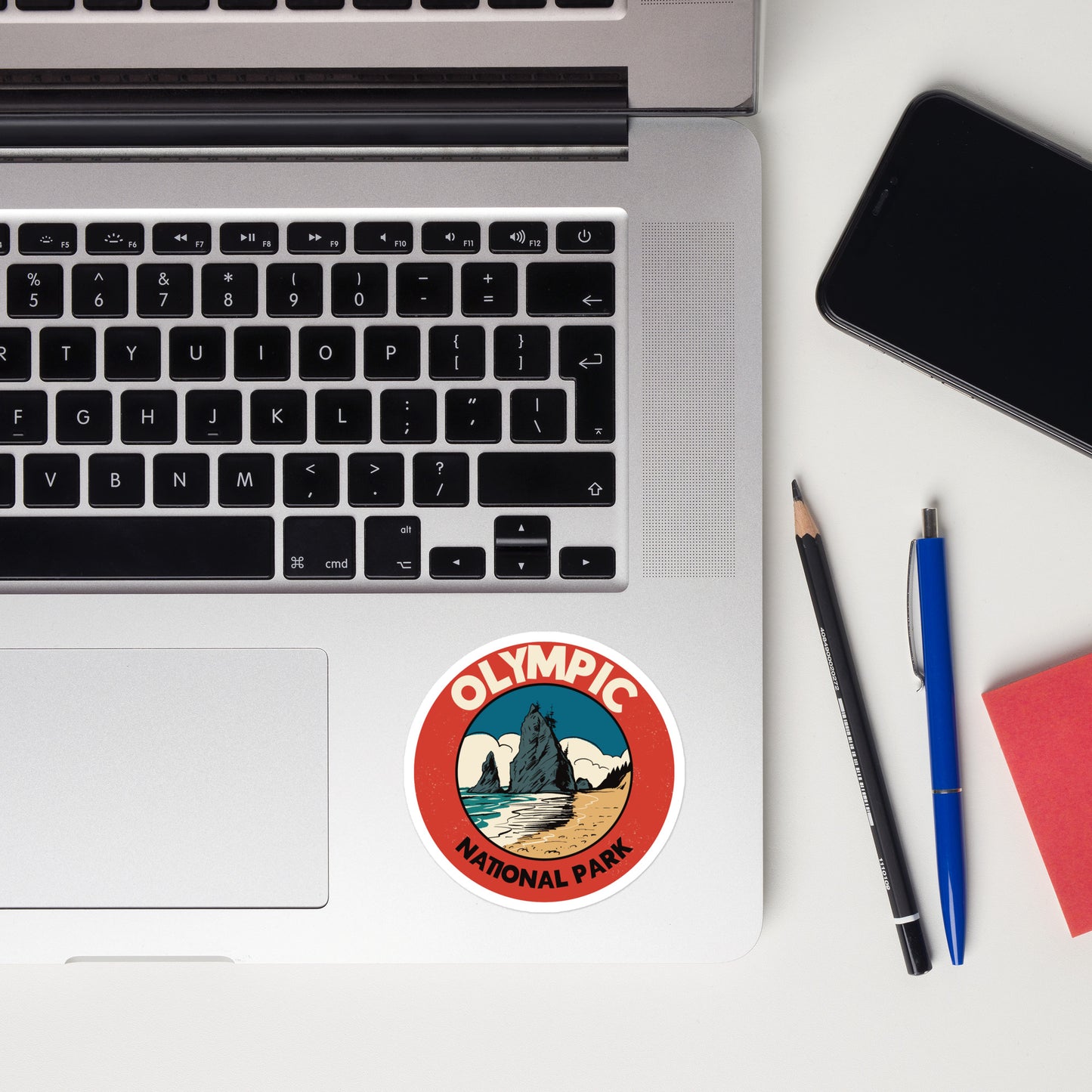 A sticker of Olympic National Park on a laptop