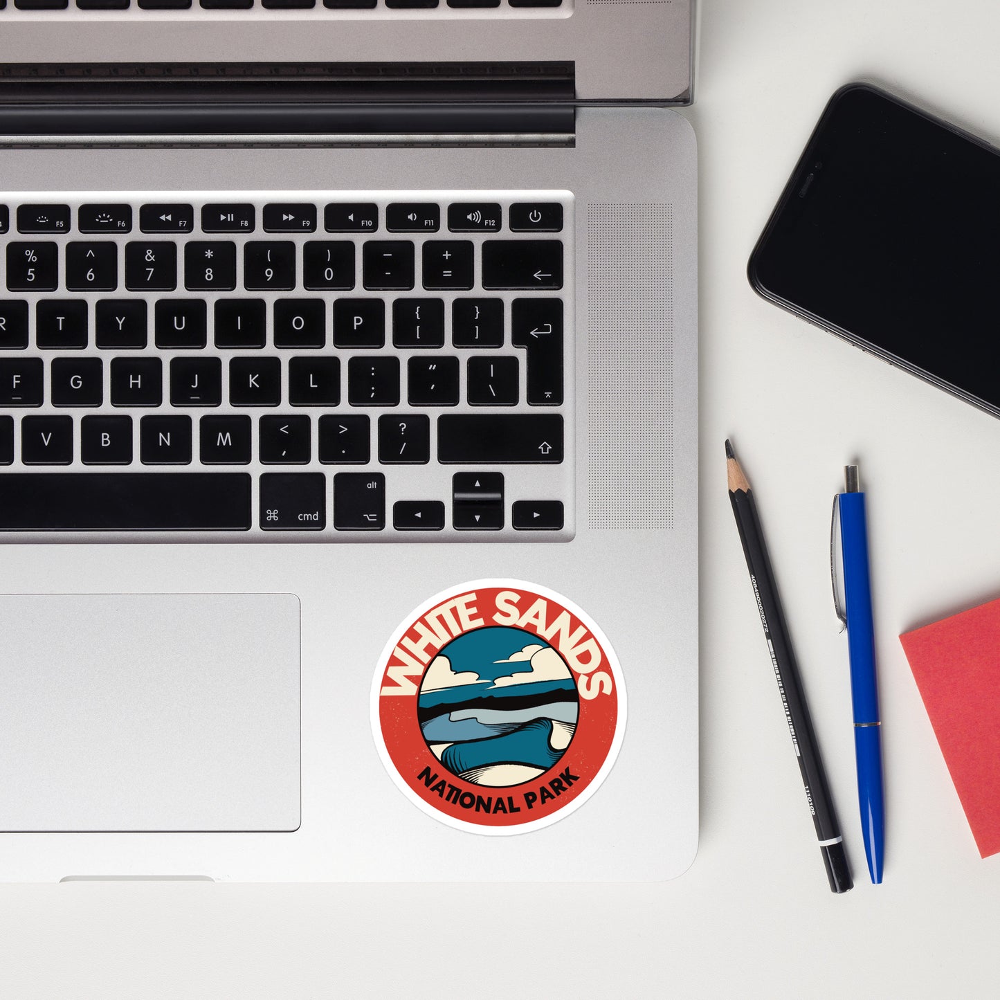 A sticker of White Sands National Park on a laptop