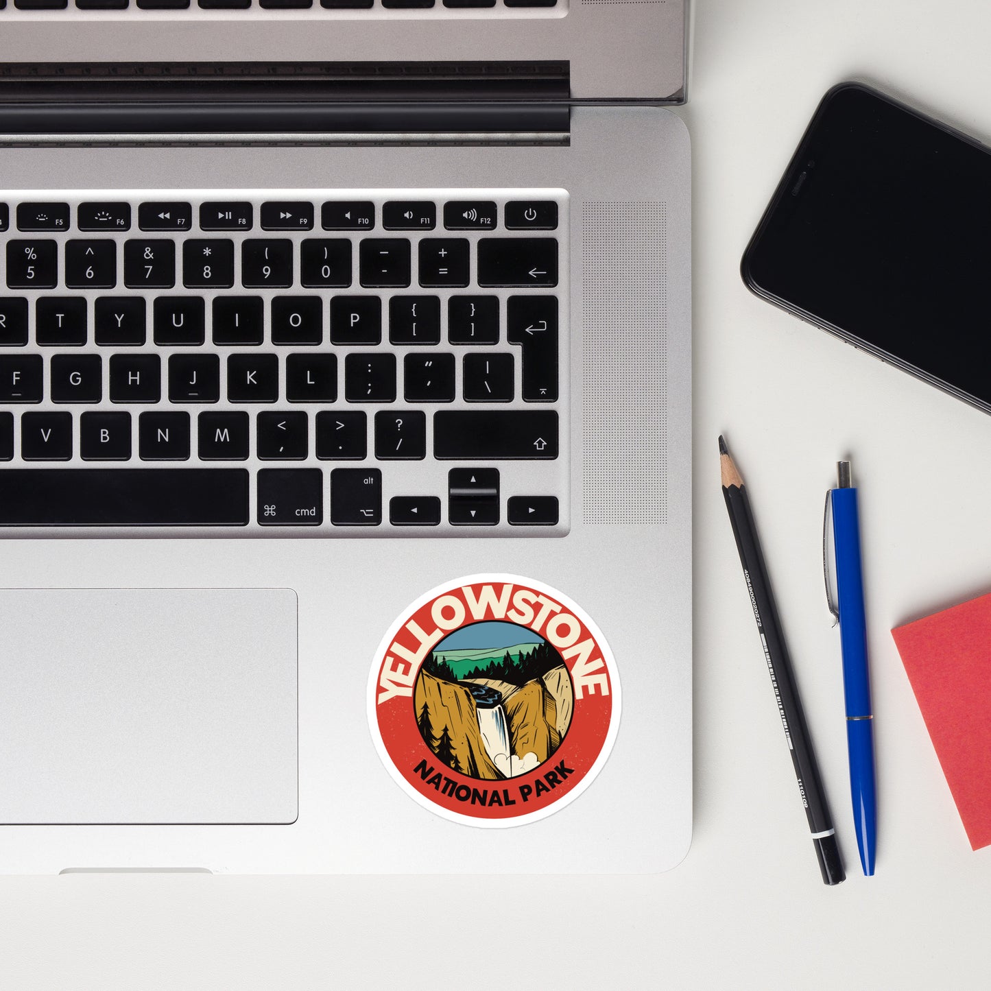 A sticker of Yellowstone National Park on a laptop