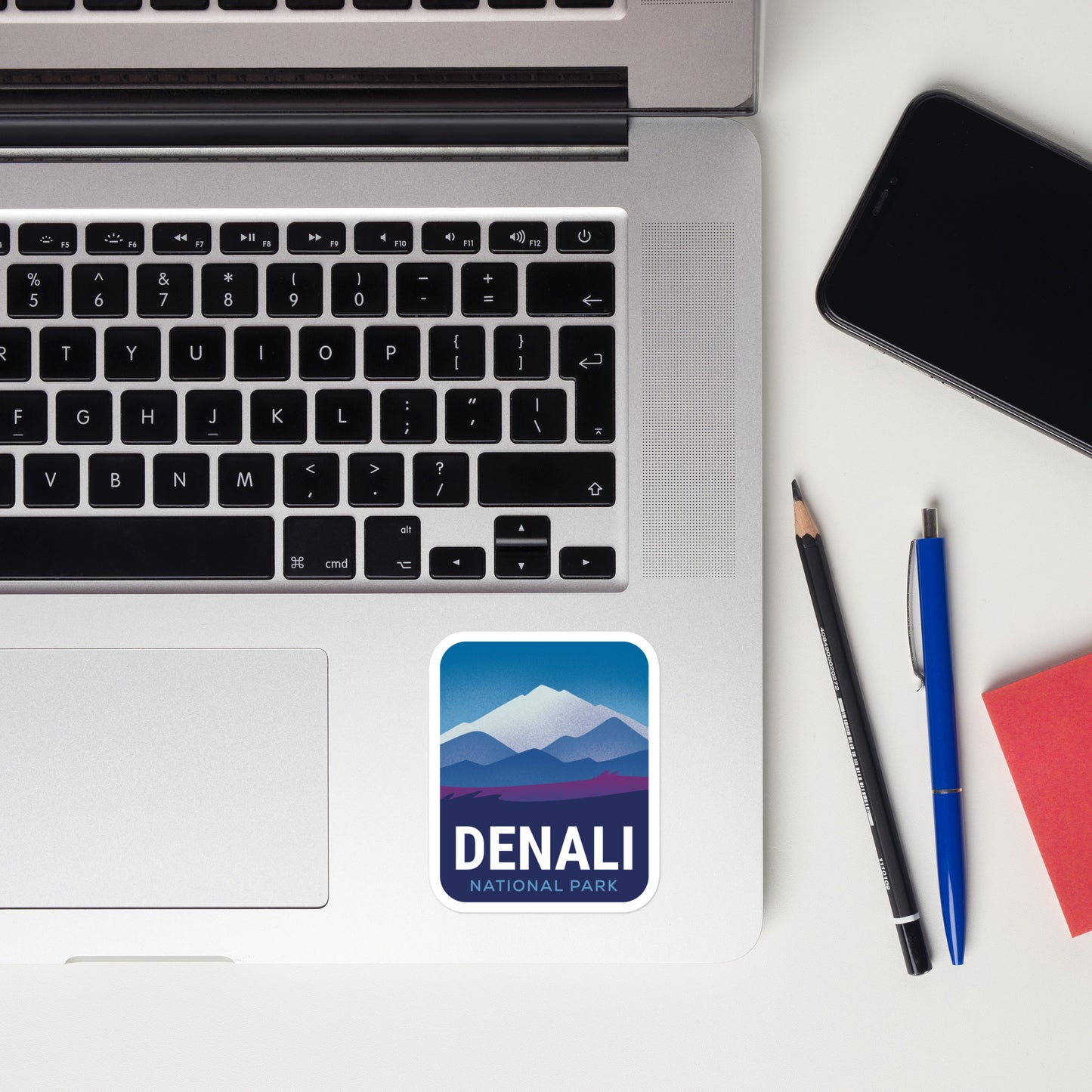 A sticker of Denali National Park on a laptop