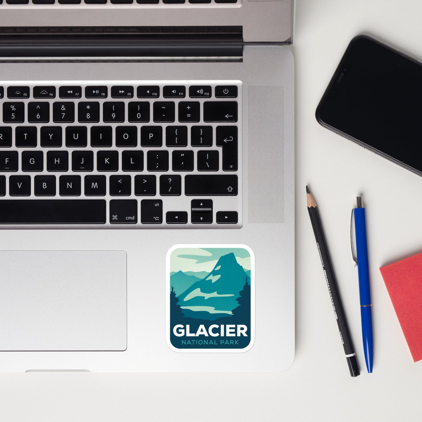 A sticker of Glacier National Park on a laptop