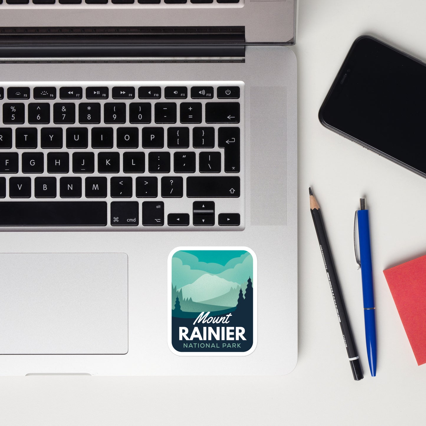 A sticker of Mount Rainier National Park on a laptop