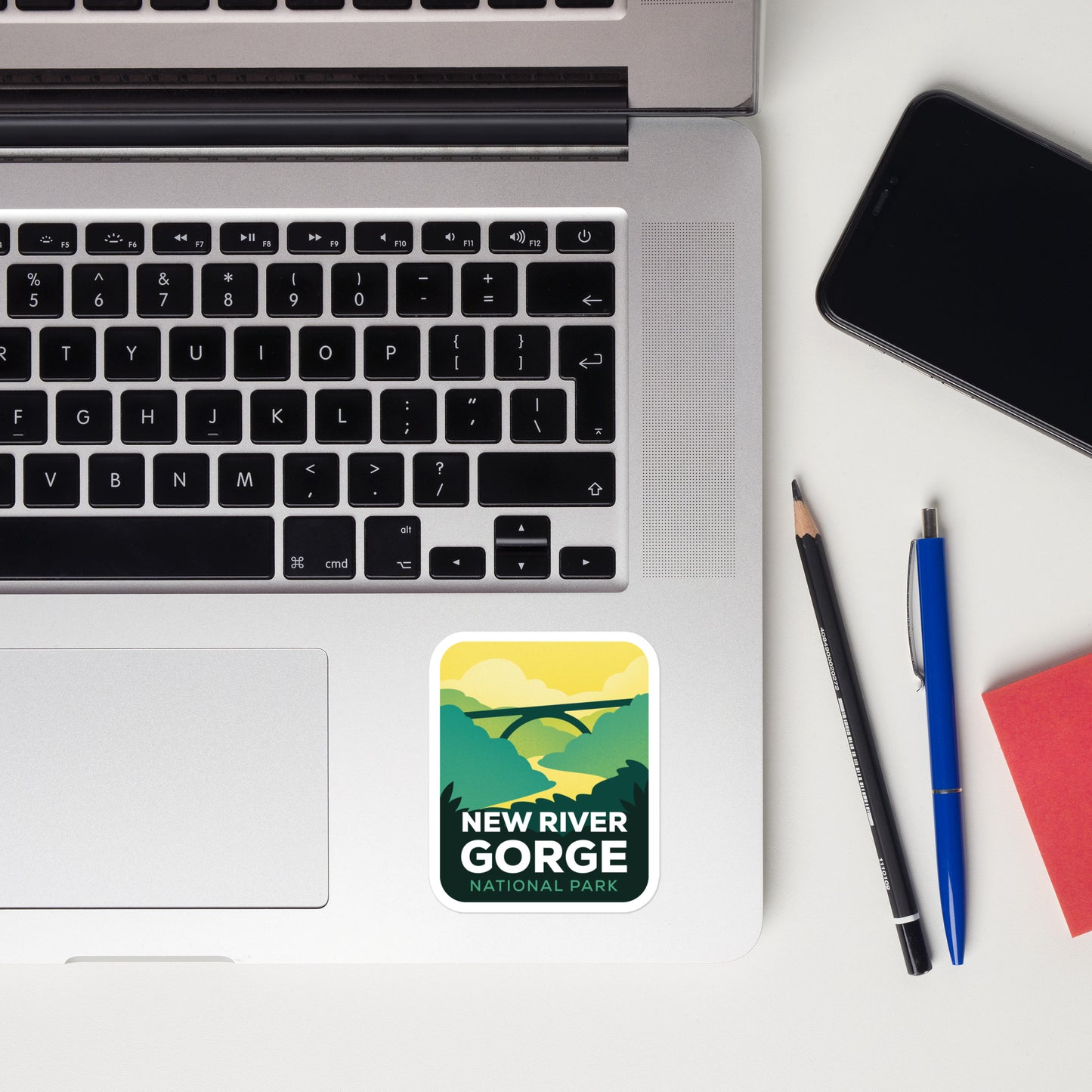 A sticker of New River Gorge National Park on a laptop