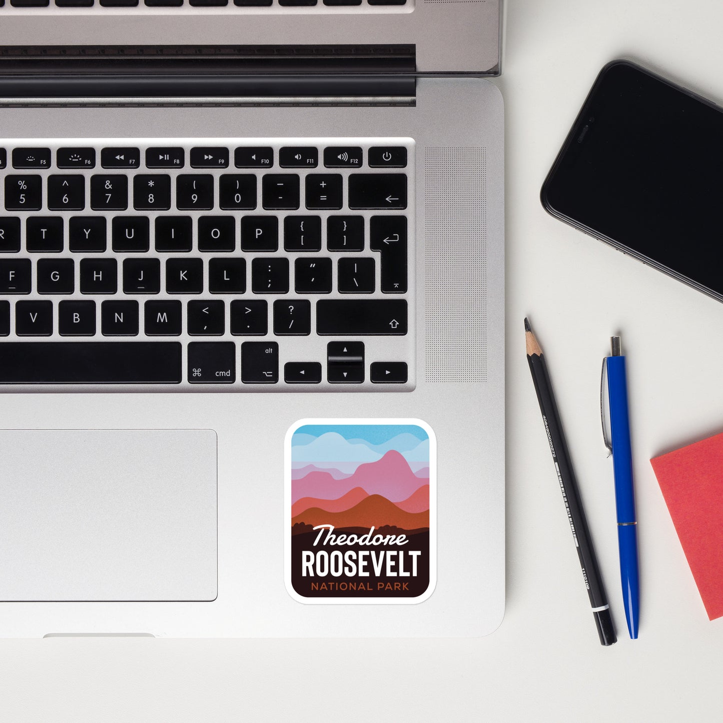 A sticker of Theodore Roosevelt National Park on a laptop