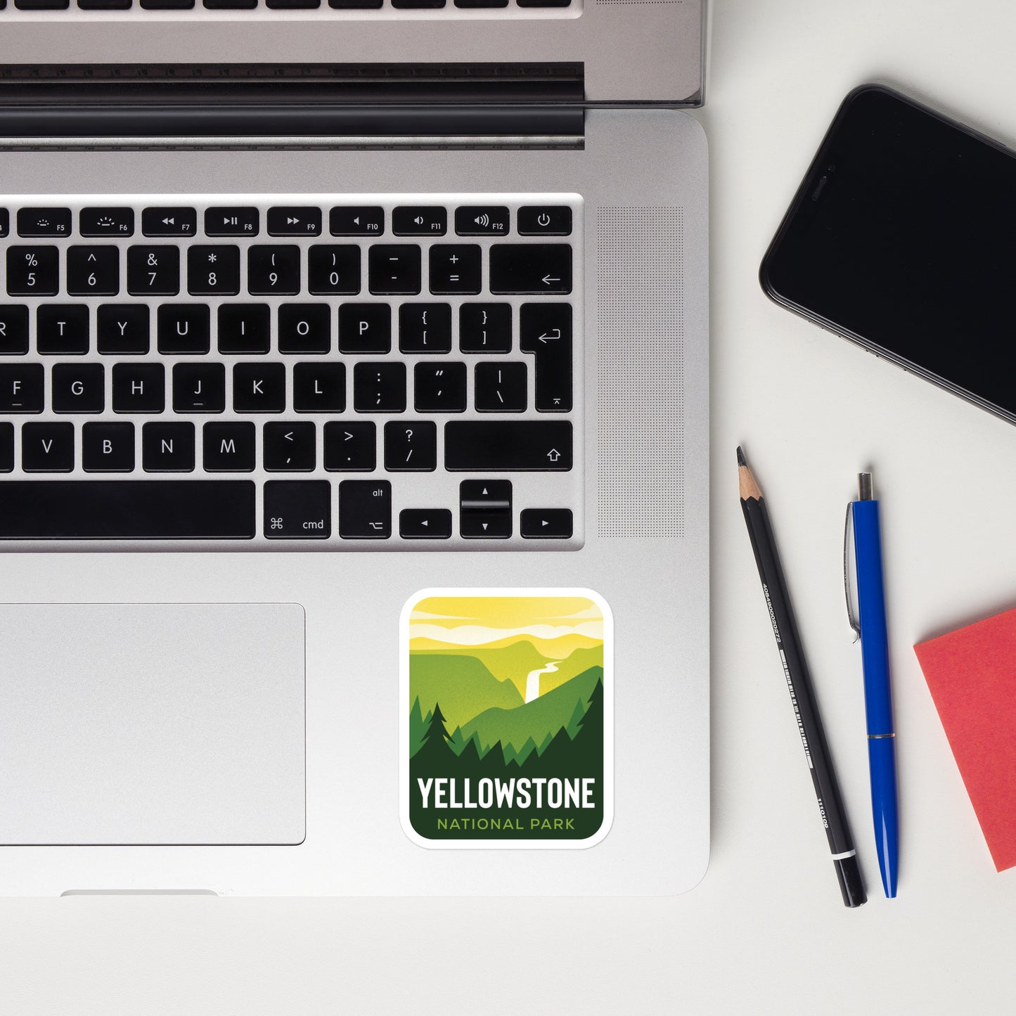 A sticker of Yellowstone National Park on a laptop