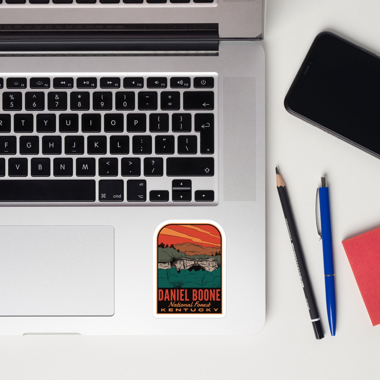 A sticker of Daniel Boone National Forest on a laptop
