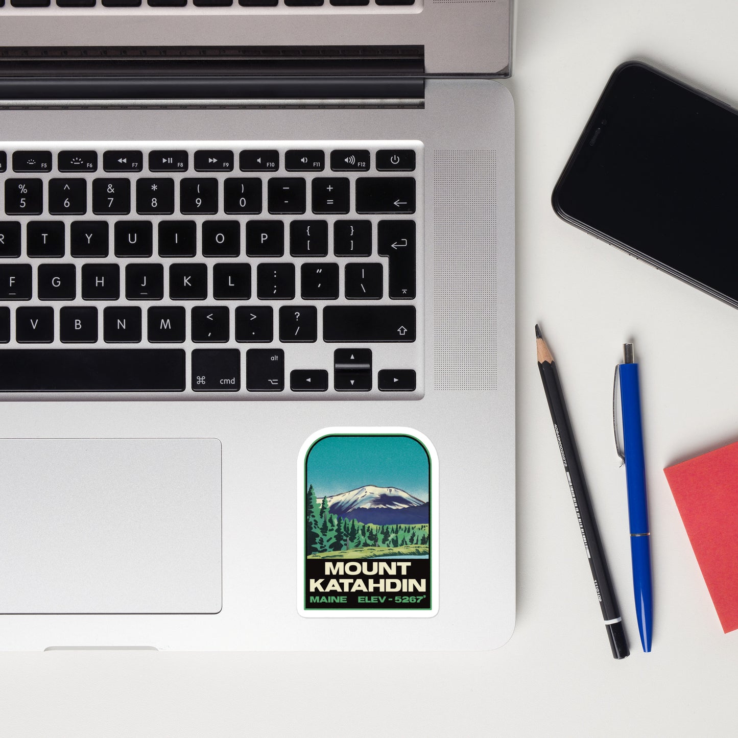 A sticker of Mount Katahdin Maine on a laptop