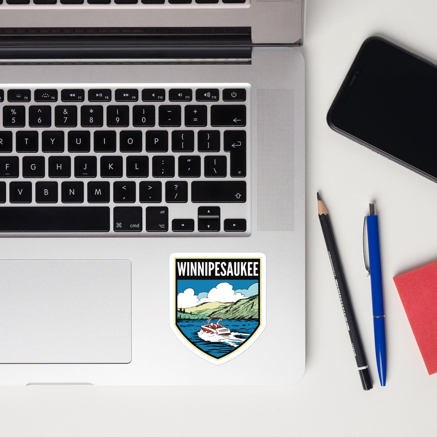 A sticker of Lake Winnipesaukee on a laptop