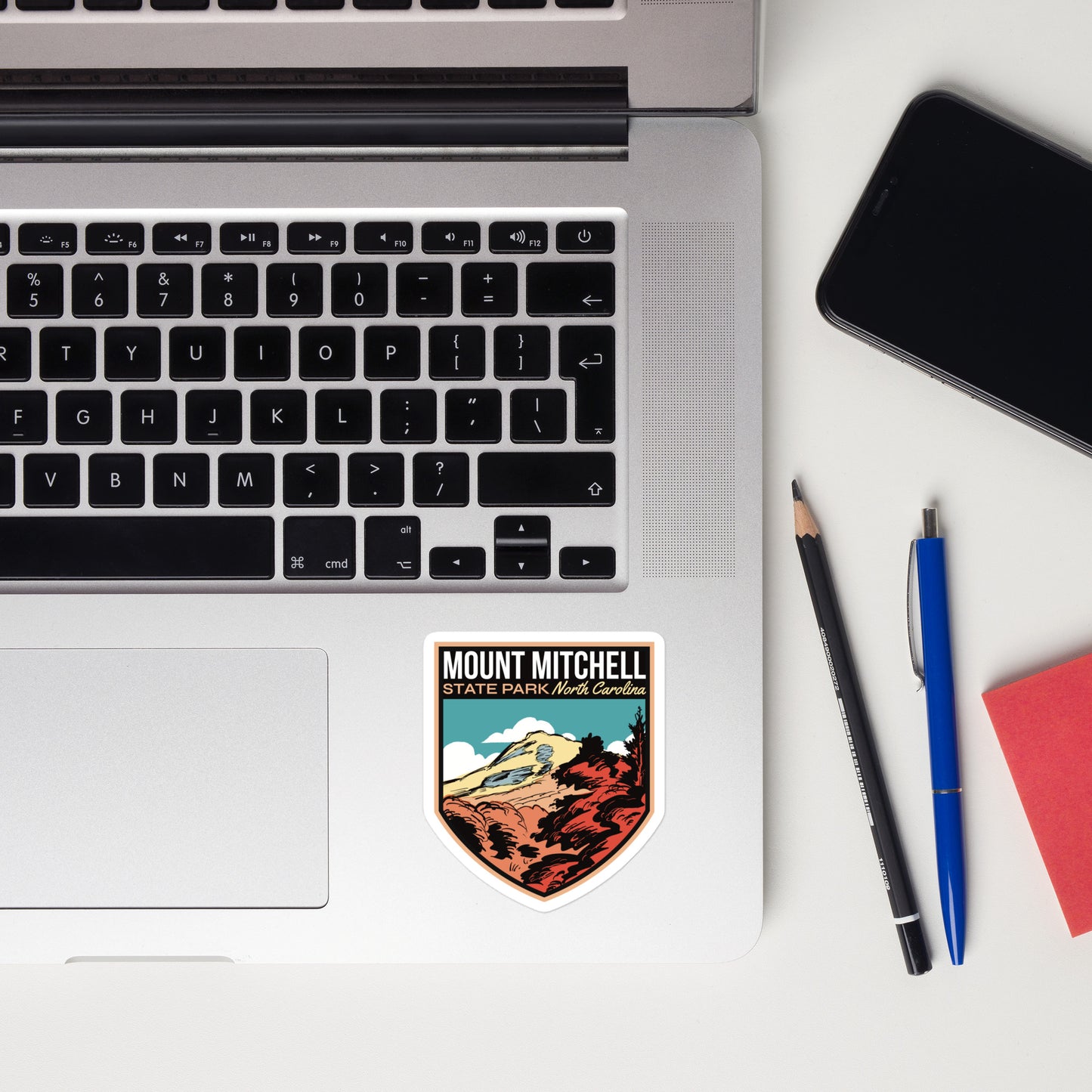 A sticker of Mount Mitchell State Park on a laptop