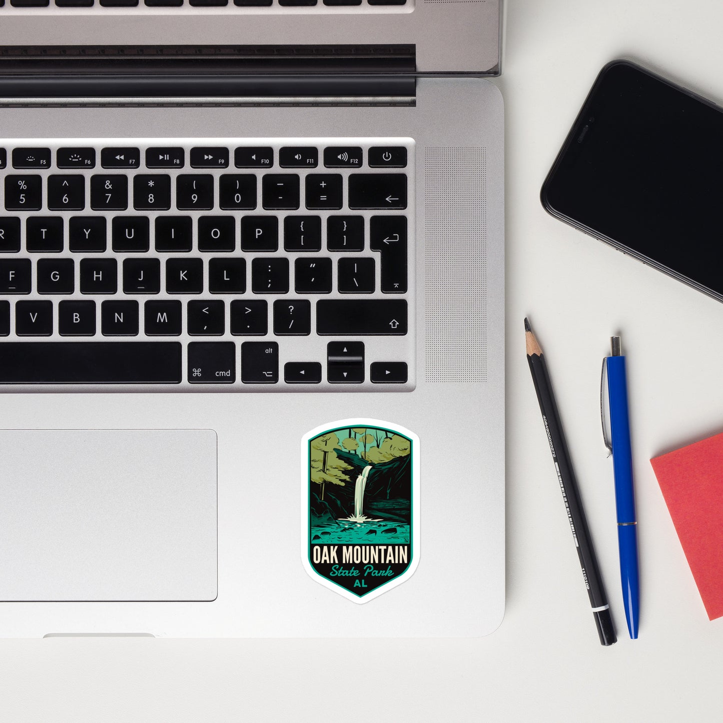 A sticker of Oak Mountain State Park on a laptop