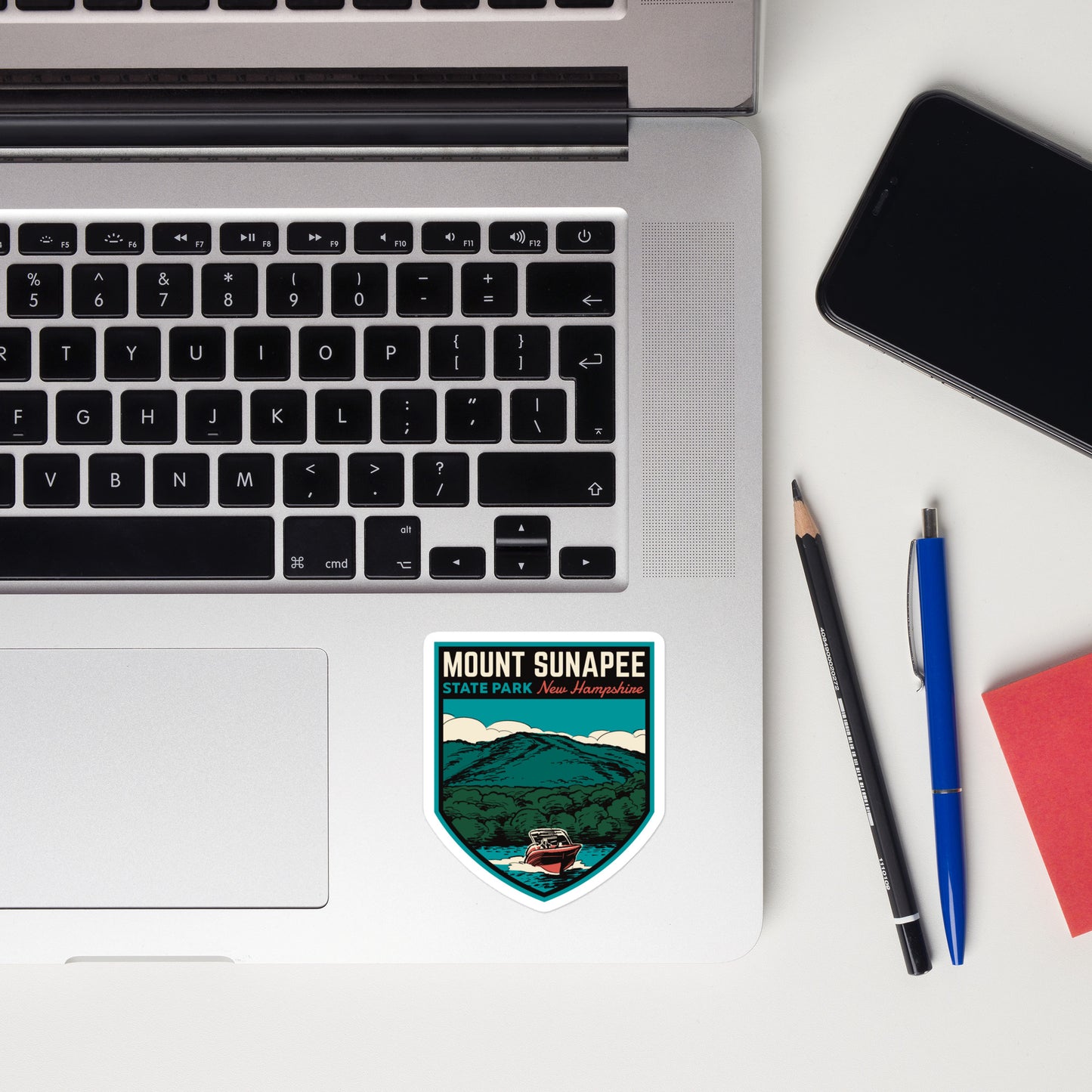 A sticker of Mount Sunapee State Park on a laptop