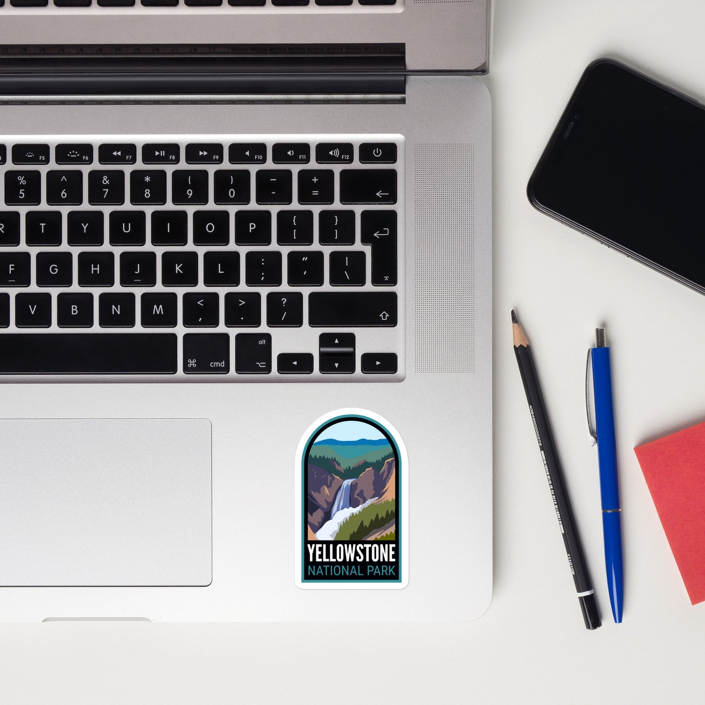A sticker of Yellowstone National Park on a laptop