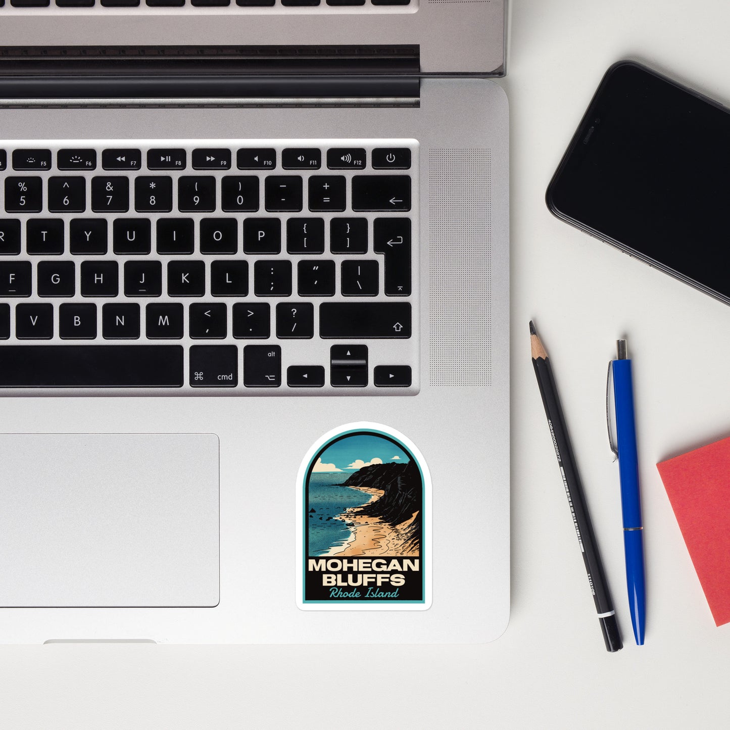 A sticker of Mohegan Bluffs Rhode Island on a laptop