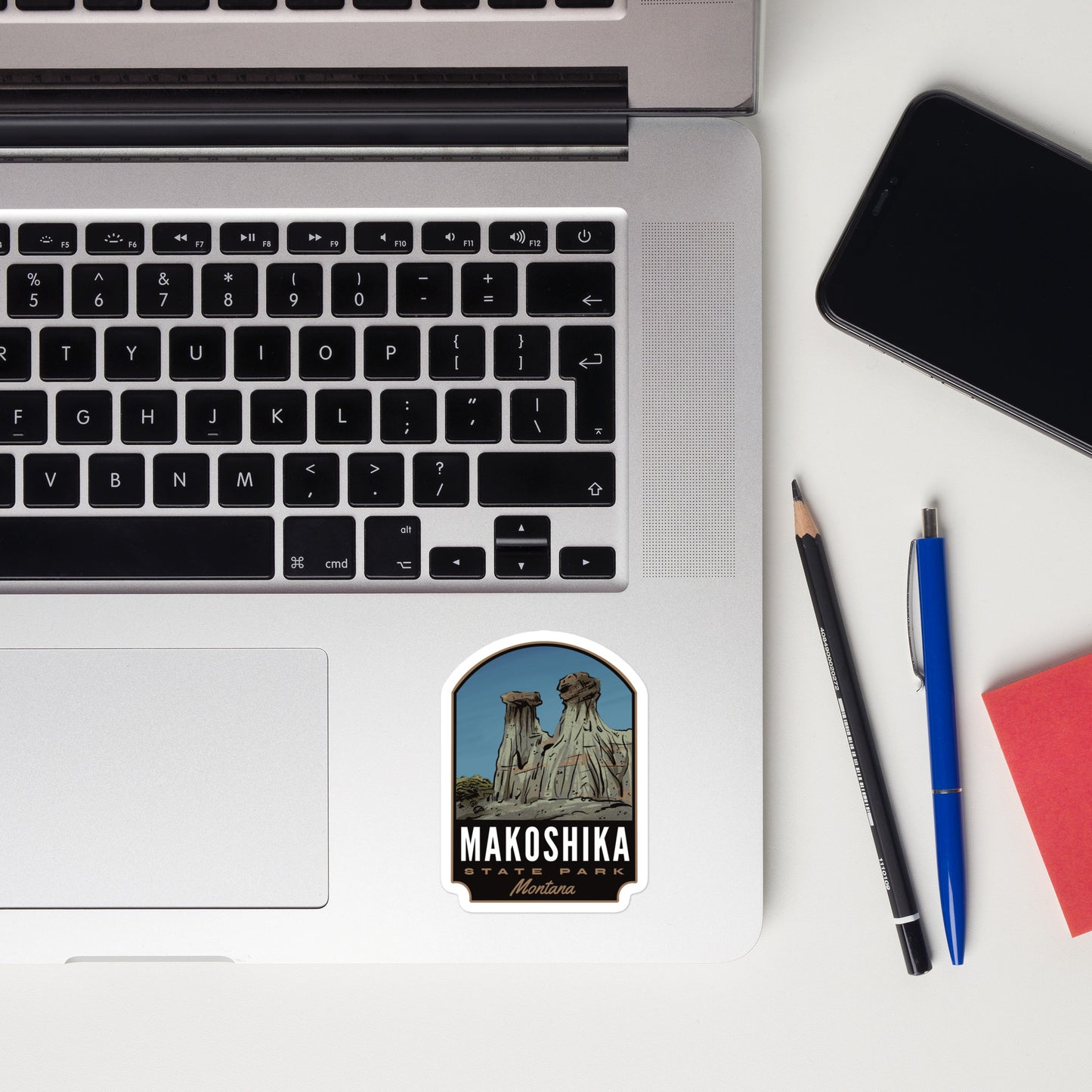 A sticker of Makoshika State Park on a laptop