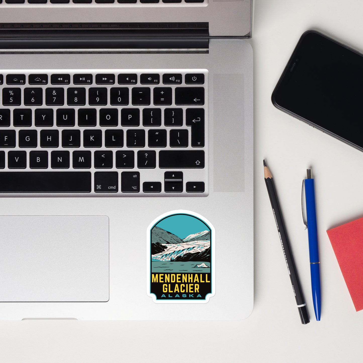 A sticker of Mendenhall Glacier Alaska on a laptop