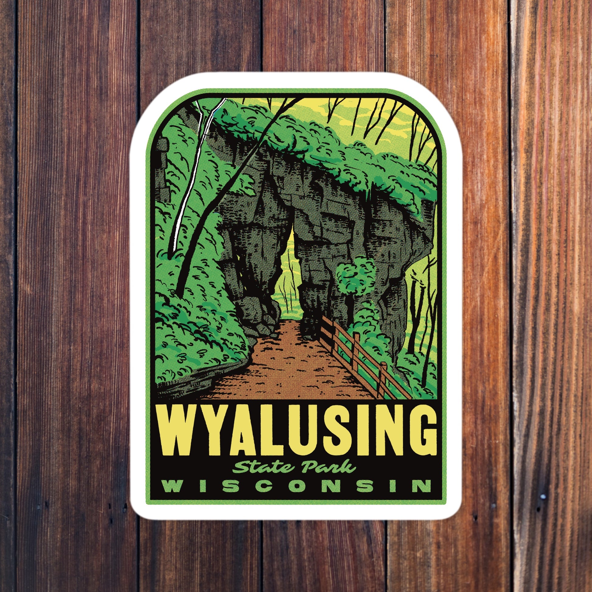 Retro Wyalusing State Park sticker on wood surface, showcasing bold vintage design with rocky trails surrounded by trees —durable, waterproof vinyl ideal for hikers and outdoor enthusiasts