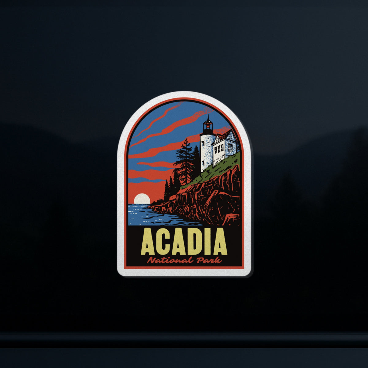 a sticker of Acadia National Park on a car window