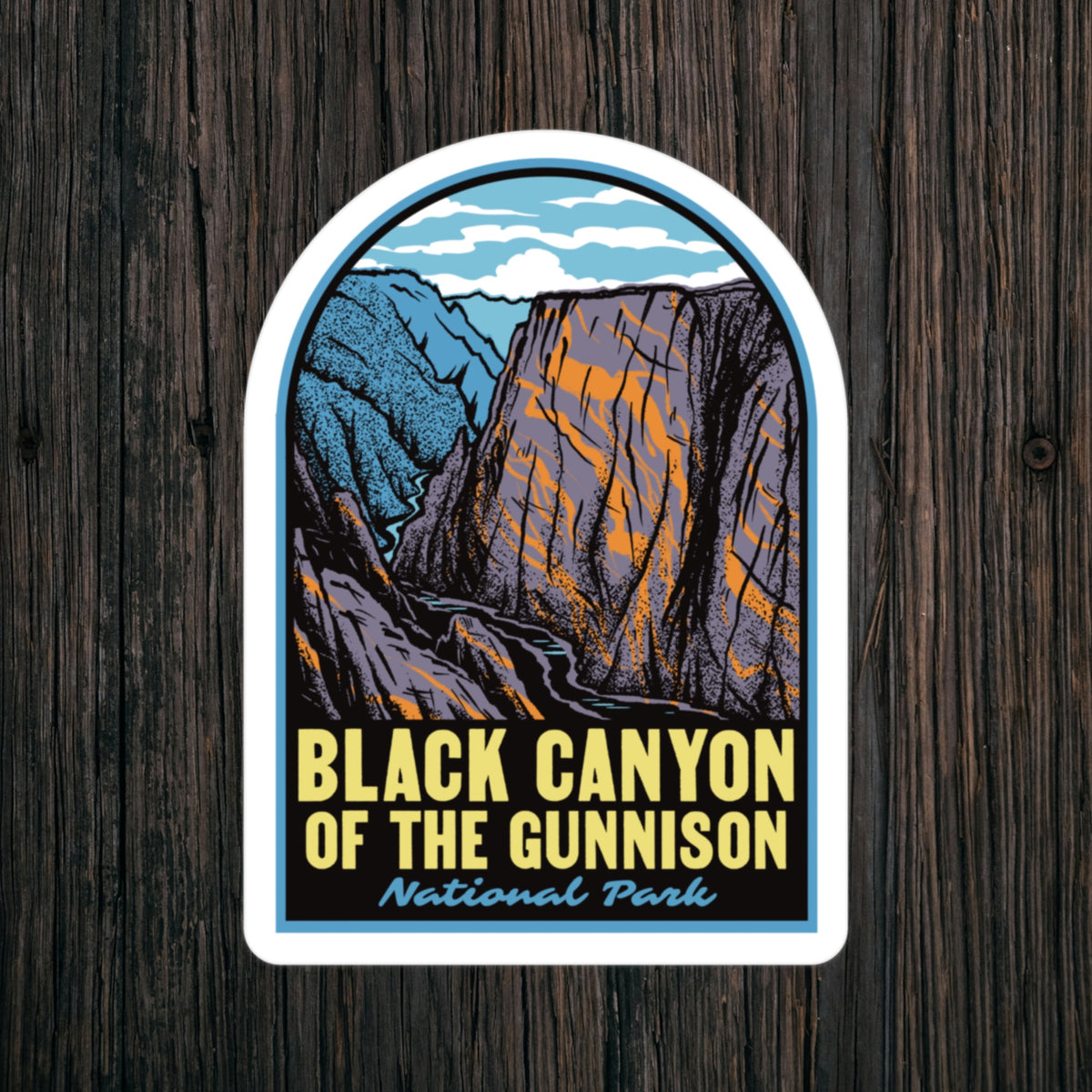 a sticker of Black Canyon of the Gunnison National Park on a wood background