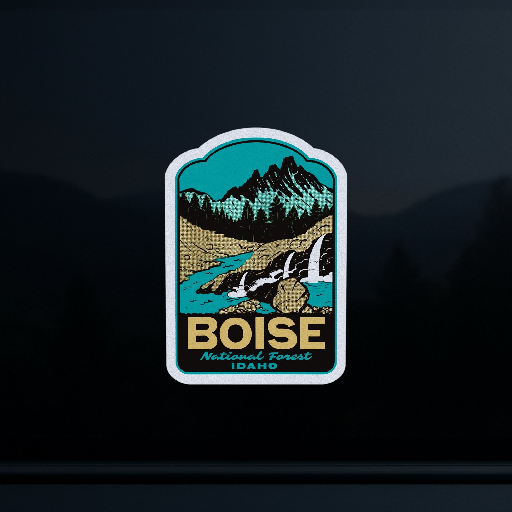 Boise National Forest Idaho patch with mountain and river design on a dark car window background