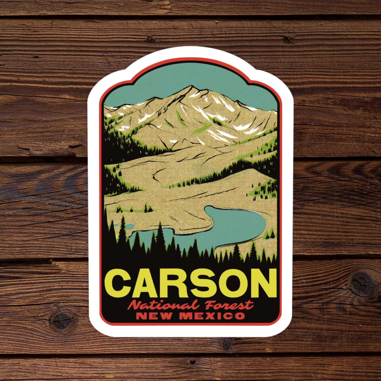 Sticker of Carson National Forest, New Mexico on a wooden background