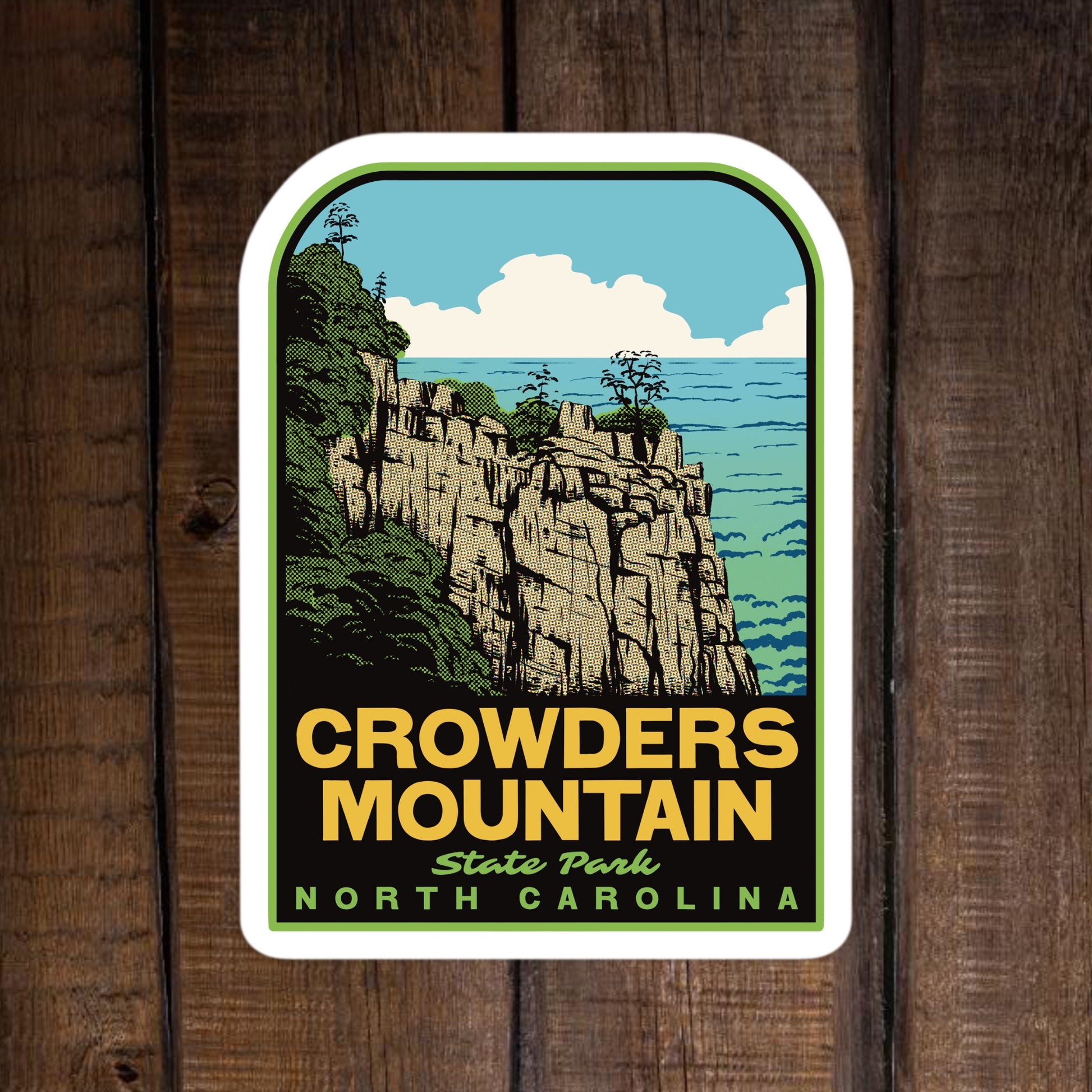 Sticker of Crowders Mountain State Park, North Carolina on a wooden background