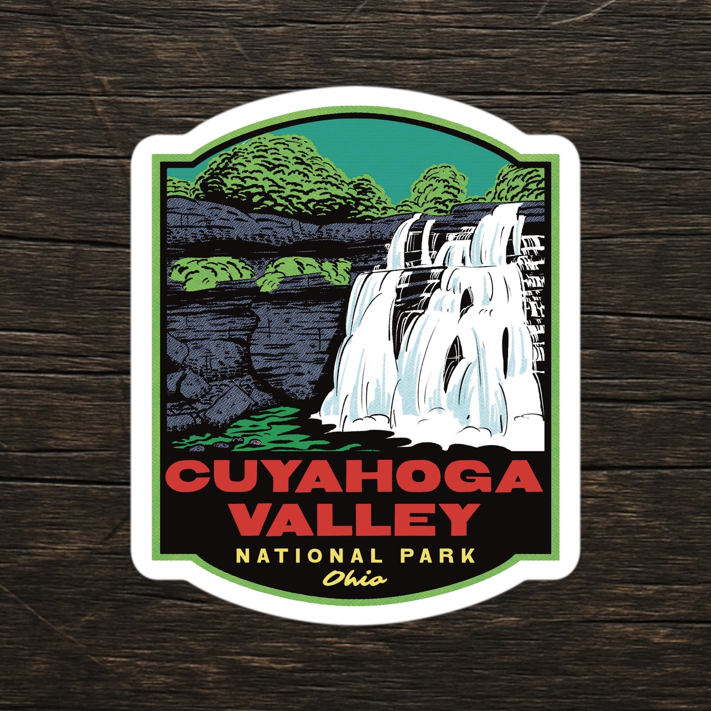 A sticker of Cuyahoga Valley National Park on a wood table
