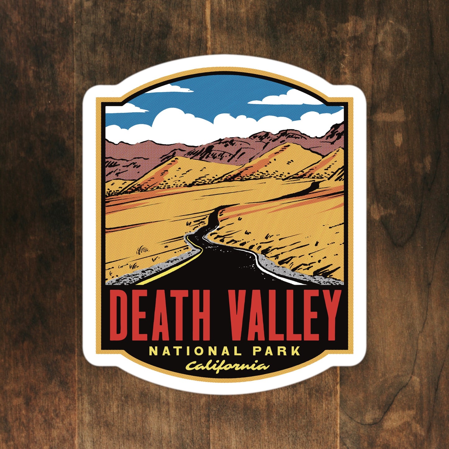 A sticker of Death Valley National Park on a wood surface
